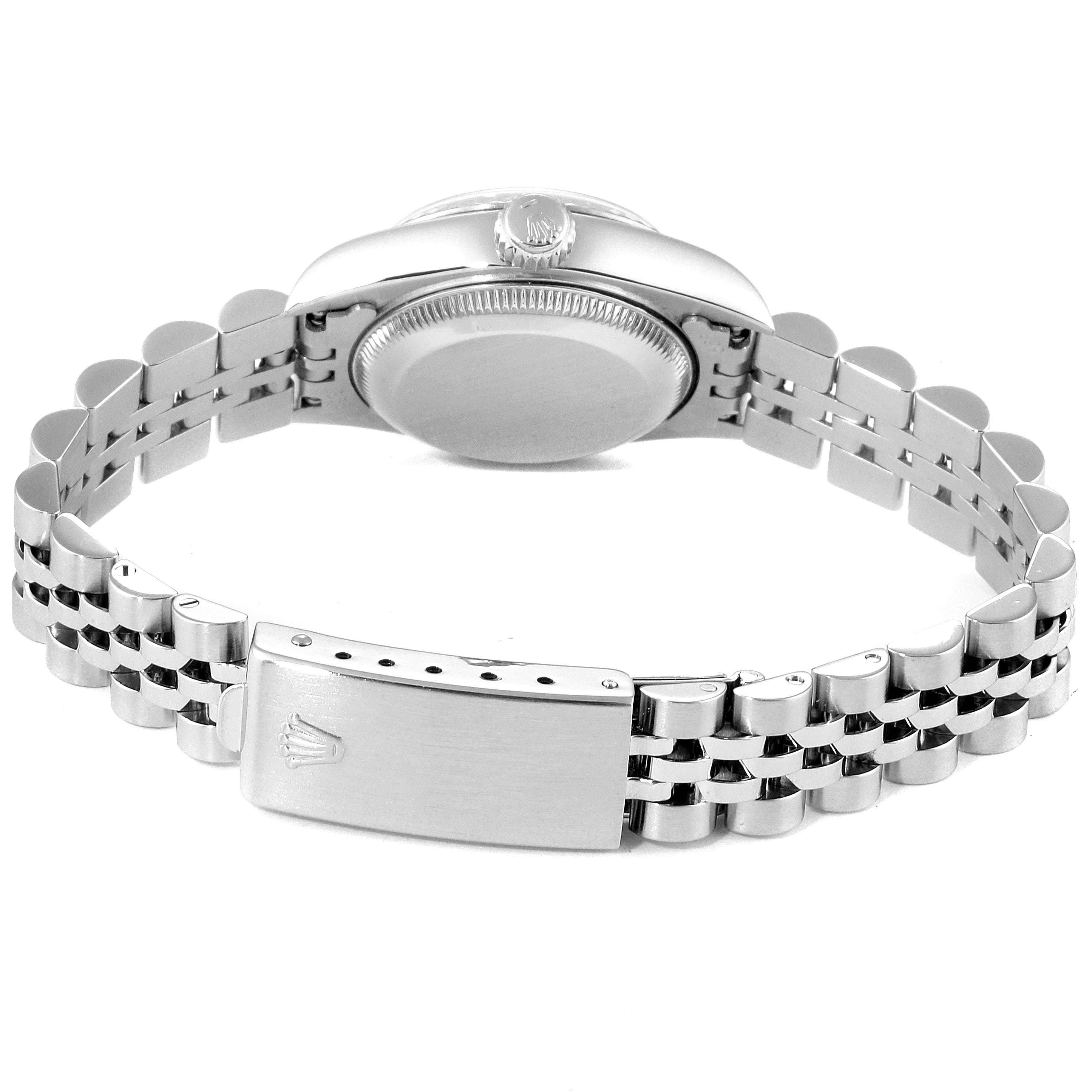 The image shows the back view of a Rolex Datejust 69174 Women's Stainless Steel White Dial 69174 Women's Stainless Steel White Dial watch, highlighting the stainless steel case and bracelet with the clasp open.