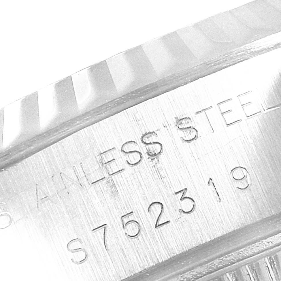 The image shows a close-up of the serial number engraving on the casing of a Rolex Datejust 69174 Women's Stainless Steel White Dial 69174 Women's Stainless Steel White Dial watch.