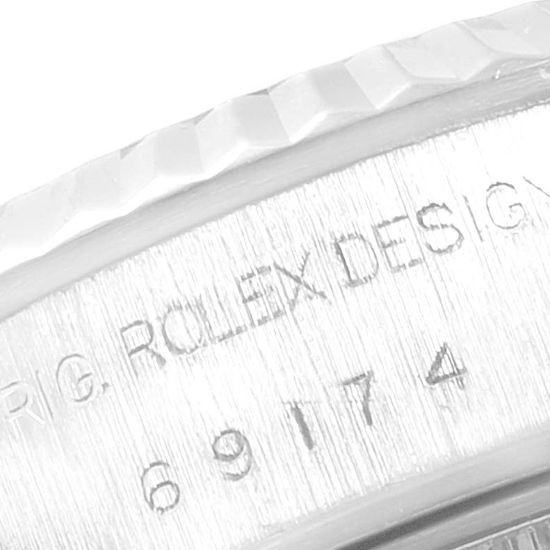 This image shows a close-up of the side engraving on the bezel of the Rolex Datejust 69174 Women's Stainless Steel White Dial 69174 Women's Stainless Steel White Dial model.