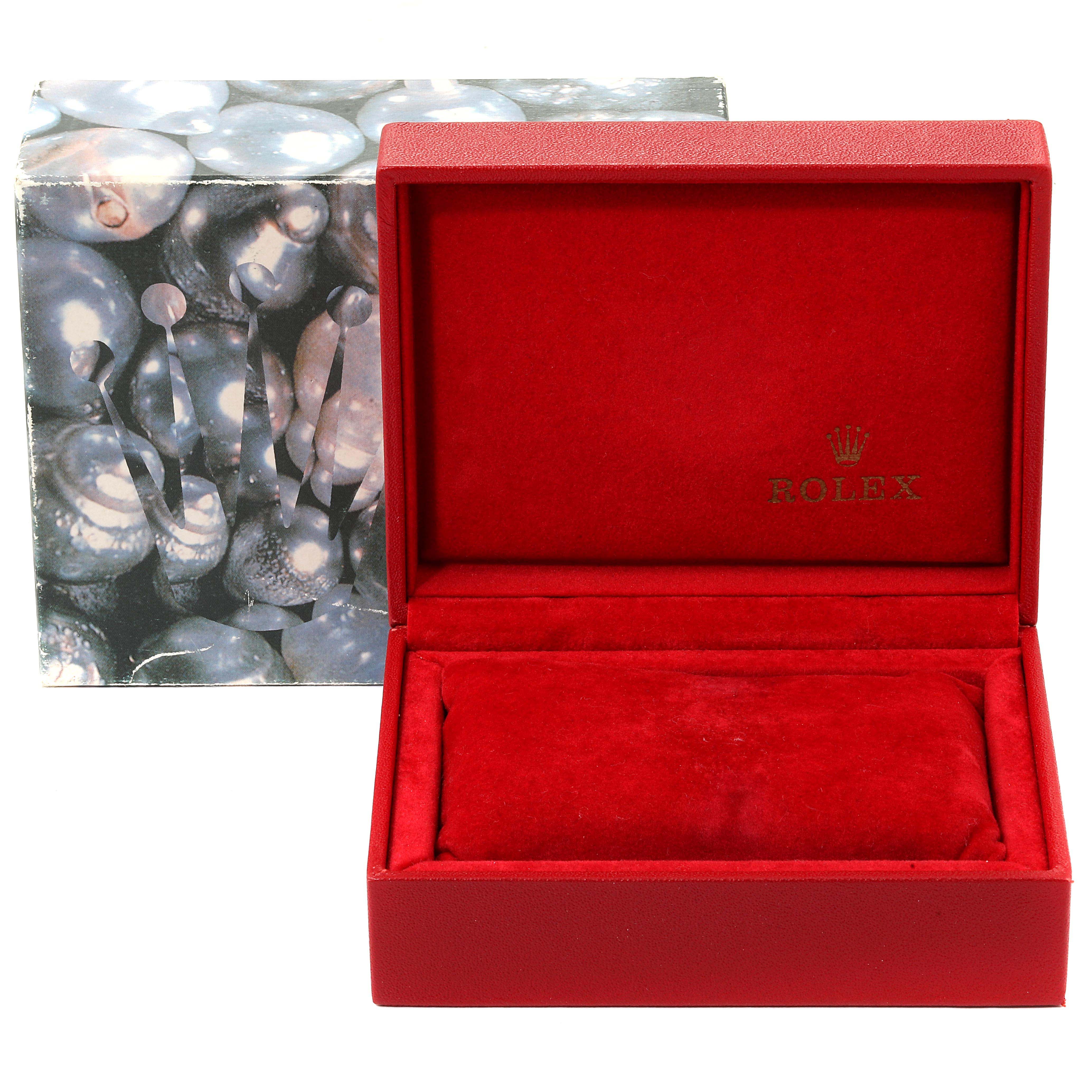 A Rolex Datejust 79174 Women's Stainless Steel Pink Dial 79174 Women's Stainless Steel Pink Dial watch box is shown from a front angle, displaying its red interior and outer packaging.