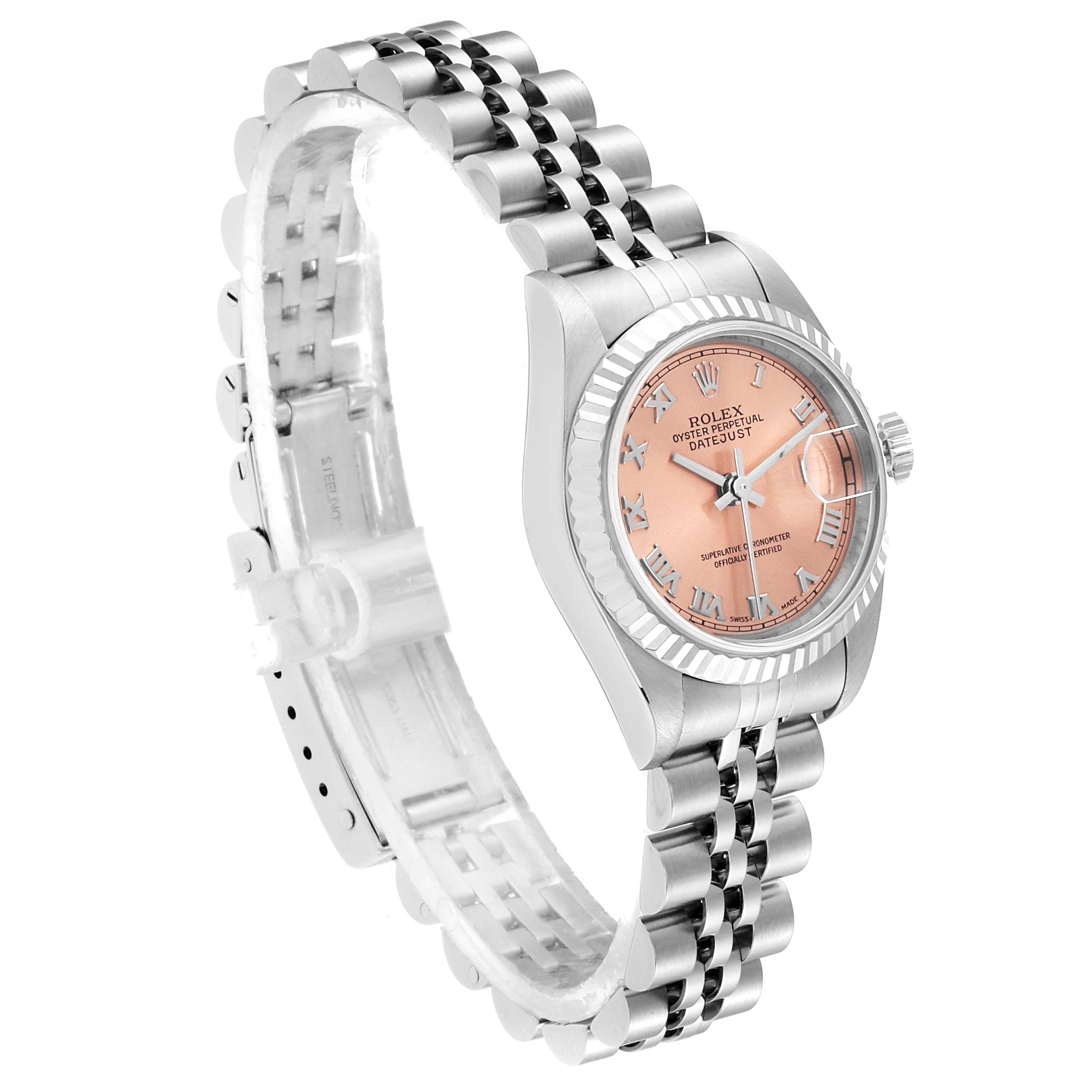 The Rolex Datejust 79174 Women's Stainless Steel Pink Dial 79174 Women's Stainless Steel Pink Dial watch is displayed at an angled view, showing the dial, bezel, and partially opened bracelet.