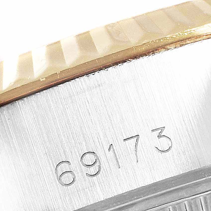 The image shows a close-up of the case side, bezel, and model number 69173 on a Rolex Datejust 69173 Women
s Steel and Gold (two tone) Champagne Dial 69173 Women
s Steel and Gold (two tone) Champagne Dial watch.