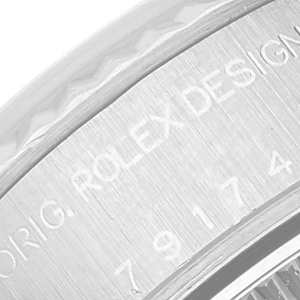 The image shows a close-up of the engraved details on the case back of a Rolex Datejust 79174 Women's Stainless Steel Silver Dial 79174 Women's Stainless Steel Silver Dial watch.