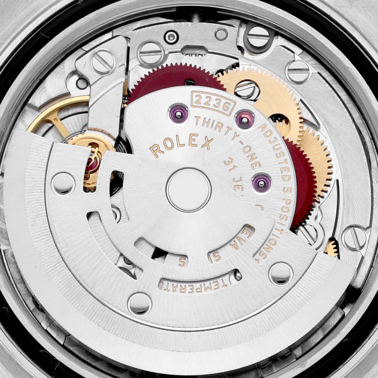 This image shows a close-up of the movement mechanism of a Rolex Datejust 279384 Women's Stainless Steel Pink Dial 279384 Women's Stainless Steel Pink Dial watch, highlighting gears and the oscillating weight.