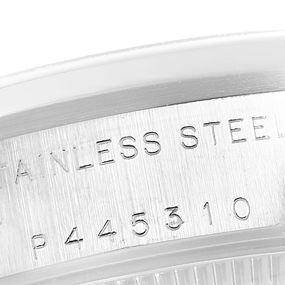 This image shows a close-up of the engraved text and serial number on the stainless steel back of a Rolex Mid-Size 78240 Women
s Stainless Steel Blue Dial 78240 Women
s Stainless Steel Blue Dial model watch.