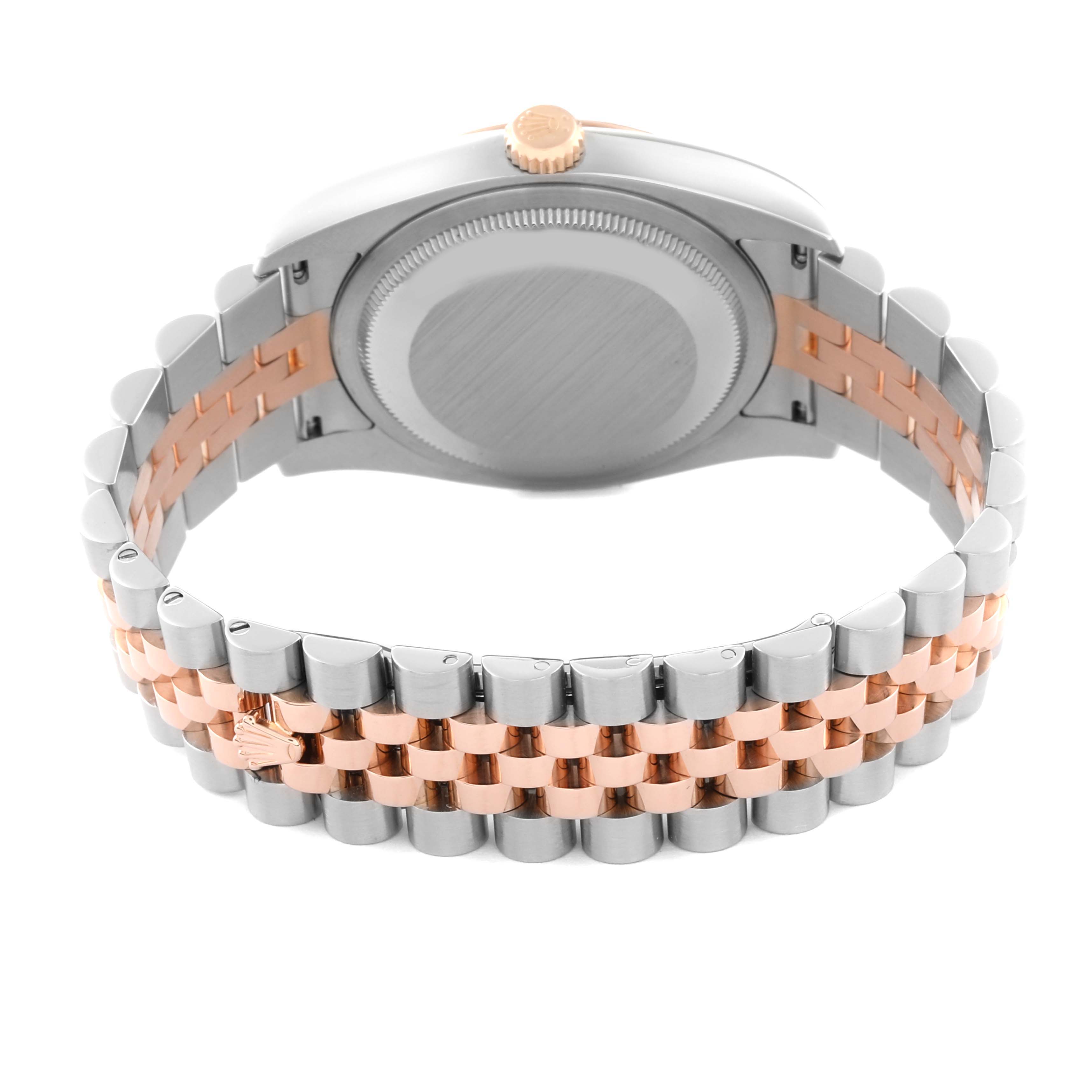 The image shows the back of a Rolex Datejust 116231 Men's Steel and Gold (two tone) Silver Dial 116231 Men's Steel and Gold (two tone) Silver Dial watch with a two-tone bracelet and crown at the top.