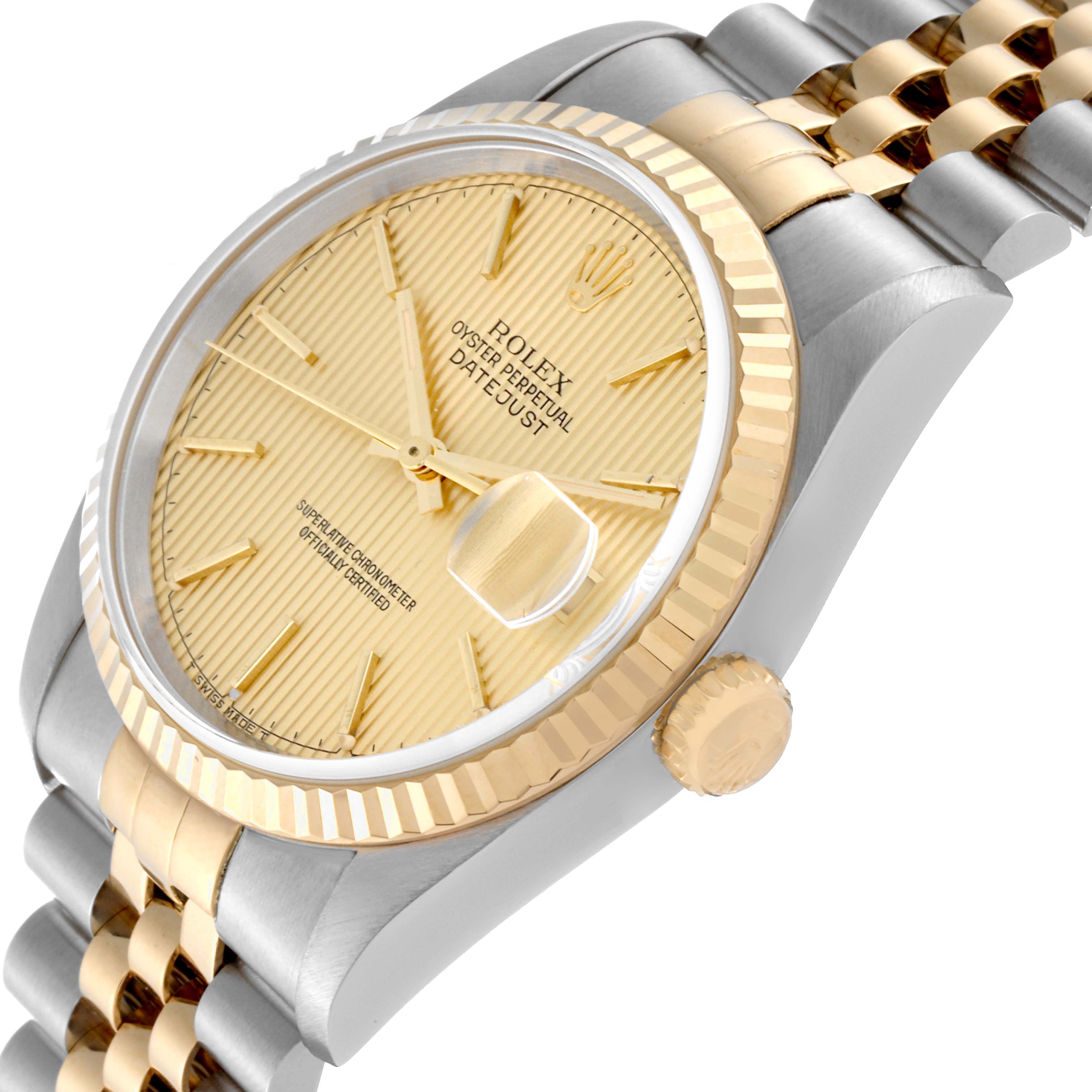 The image shows a close-up, angled view of a Rolex Datejust 16233 Men's Steel and Gold (two tone) Champagne Dial 16233 Men's Steel and Gold (two tone) Champagne Dial watch, highlighting its gold and silver bracelet, fluted bezel, and dial.