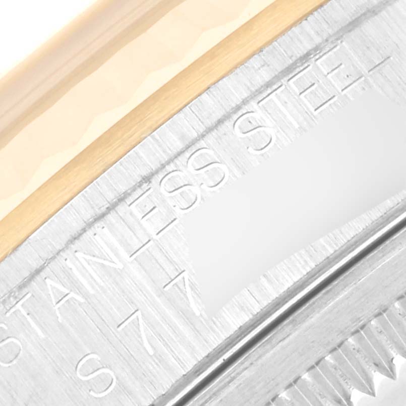 The image shows a close-up angle of the bezel and case of a Rolex Datejust 16233 Men's Steel and Gold (two tone) Champagne Dial 16233 Men's Steel and Gold (two tone) Champagne Dial watch, highlighting the "STAINLESS STEEL" engraving.