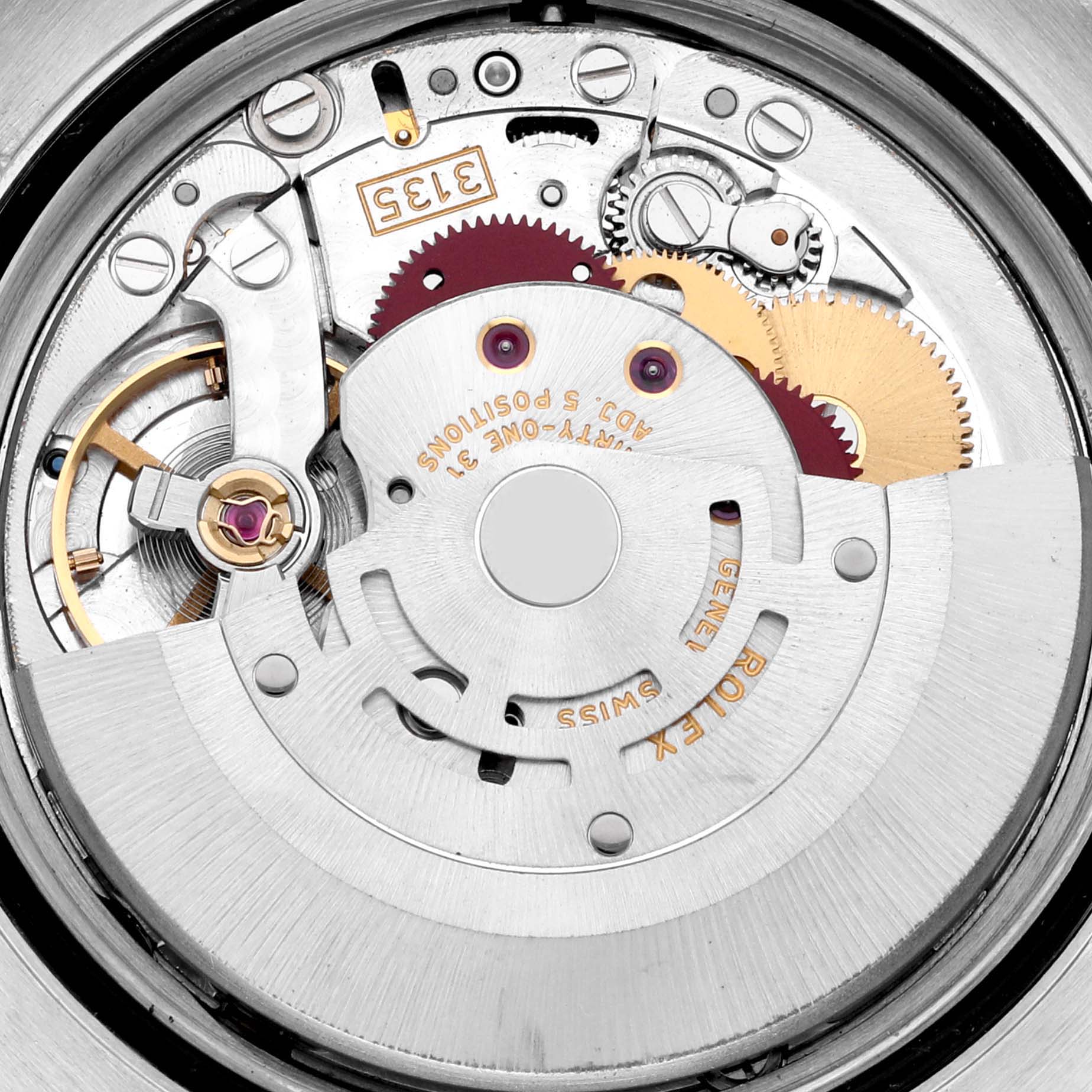 The image shows an internal view of the Rolex Datejust 116233 Men's Steel and Gold (two tone) White Dial 116233 Men's Steel and Gold (two tone) White Dial movement, including gears, the rotor, and balance wheel.
