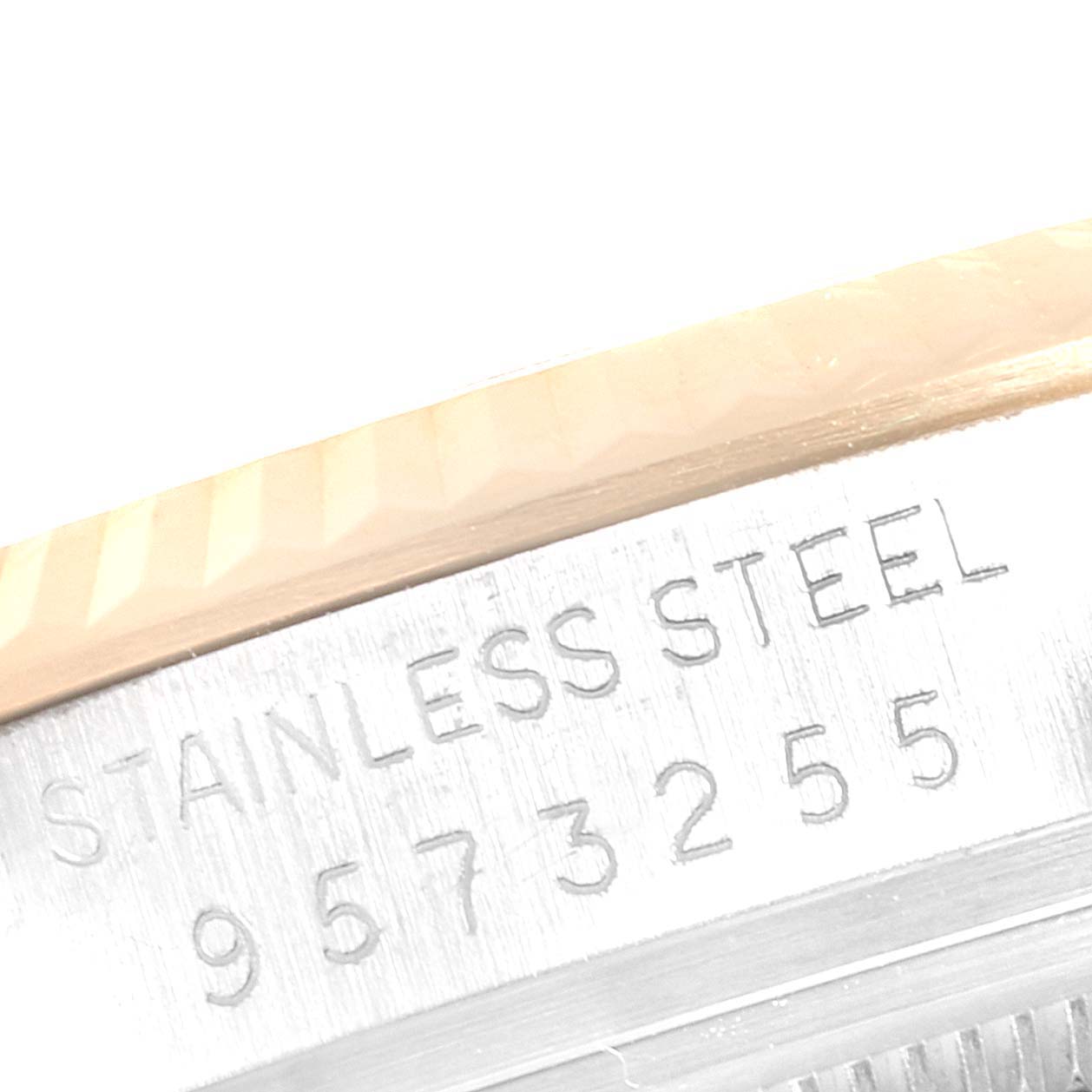 This close-up image shows the engraved serial number and "STAINLESS STEEL" marking on the band of a Rolex Datejust 16013 Men's Steel and Gold (two tone) Champagne Dial 16013 Men's Steel and Gold (two tone) Champagne Dial watch.