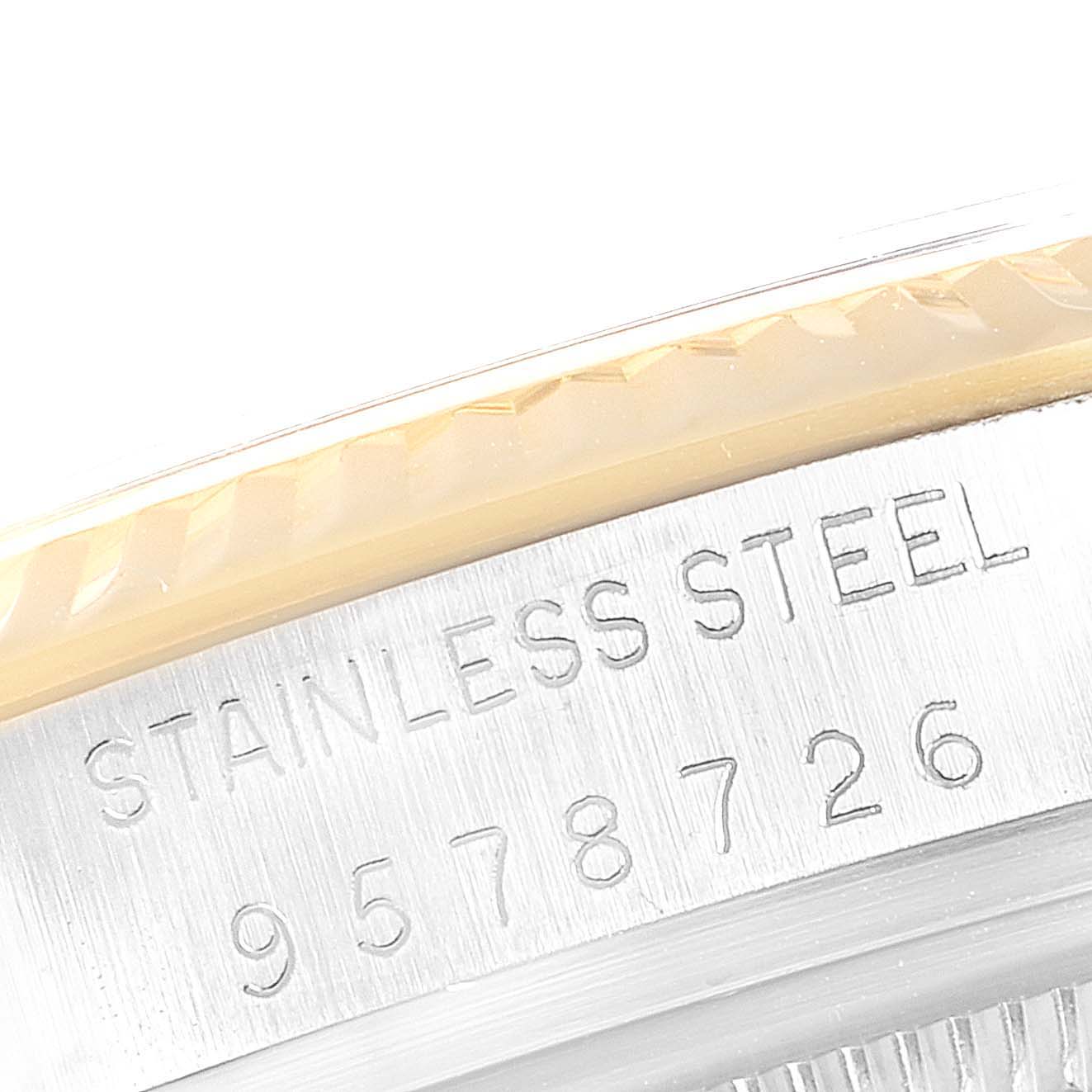 The image shows a close-up of the stainless steel case back with engraved details of a Rolex Datejust 16013 Men
s Steel and Gold (two tone) Champagne Dial 16013 Men
s Steel and Gold (two tone) Champagne Dial watch.