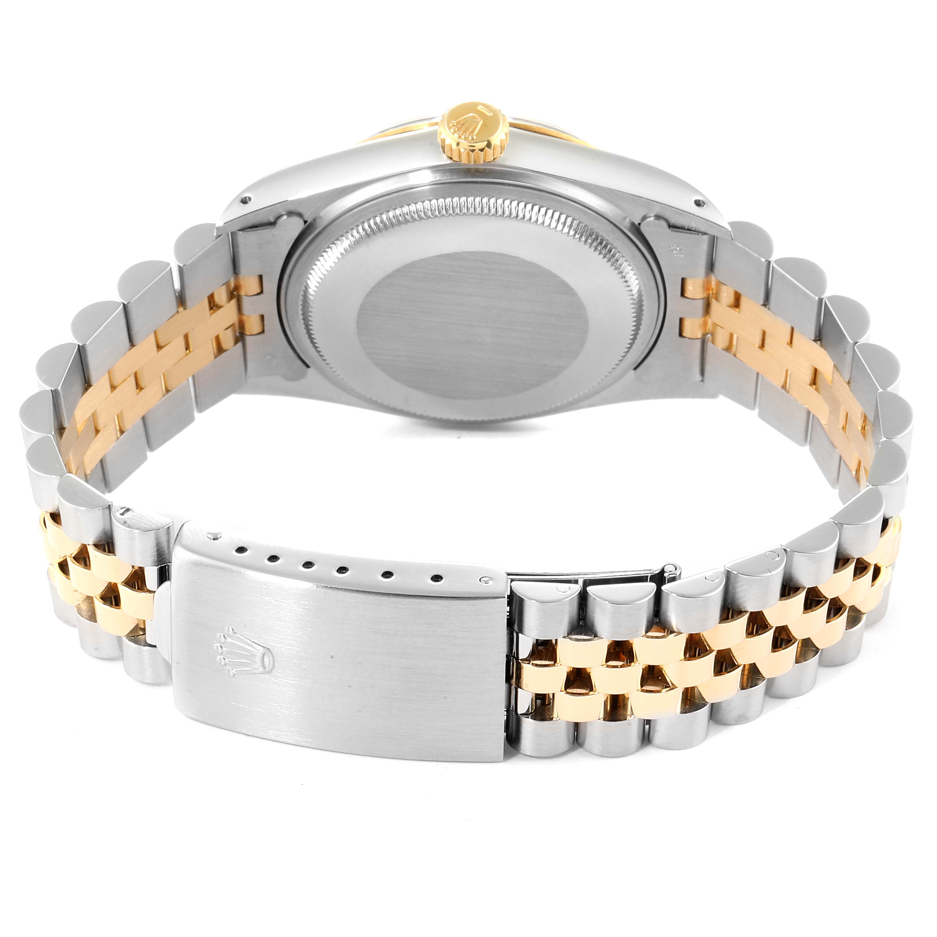 This image shows the backside and clasp of a Rolex Datejust 16013 Men
s Steel and Gold (two tone) Champagne Dial 16013 Men
s Steel and Gold (two tone) Champagne Dial watch, highlighting the bracelet and caseback.