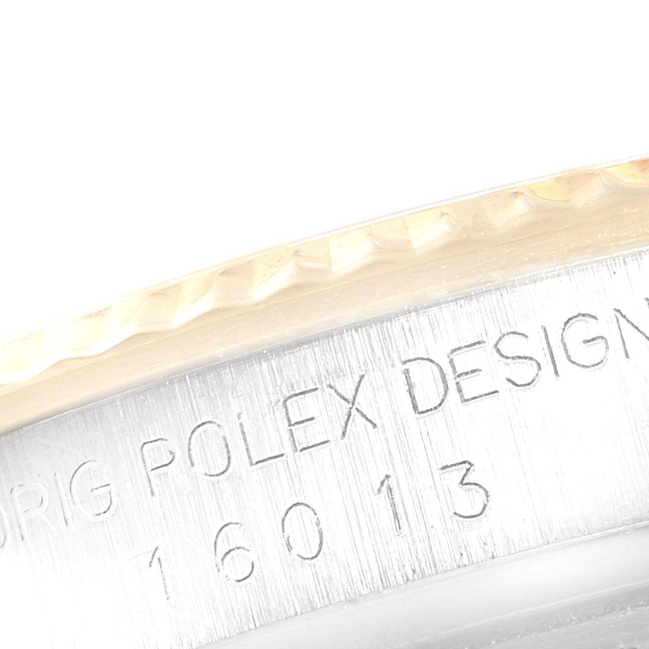 The image shows a close-up of the engraved case back edge of a Rolex Vintage Collection 16013 Men
s Steel and Gold (two tone) Champagne Dial 16013 Men
s Steel and Gold (two tone) Champagne Dial model.