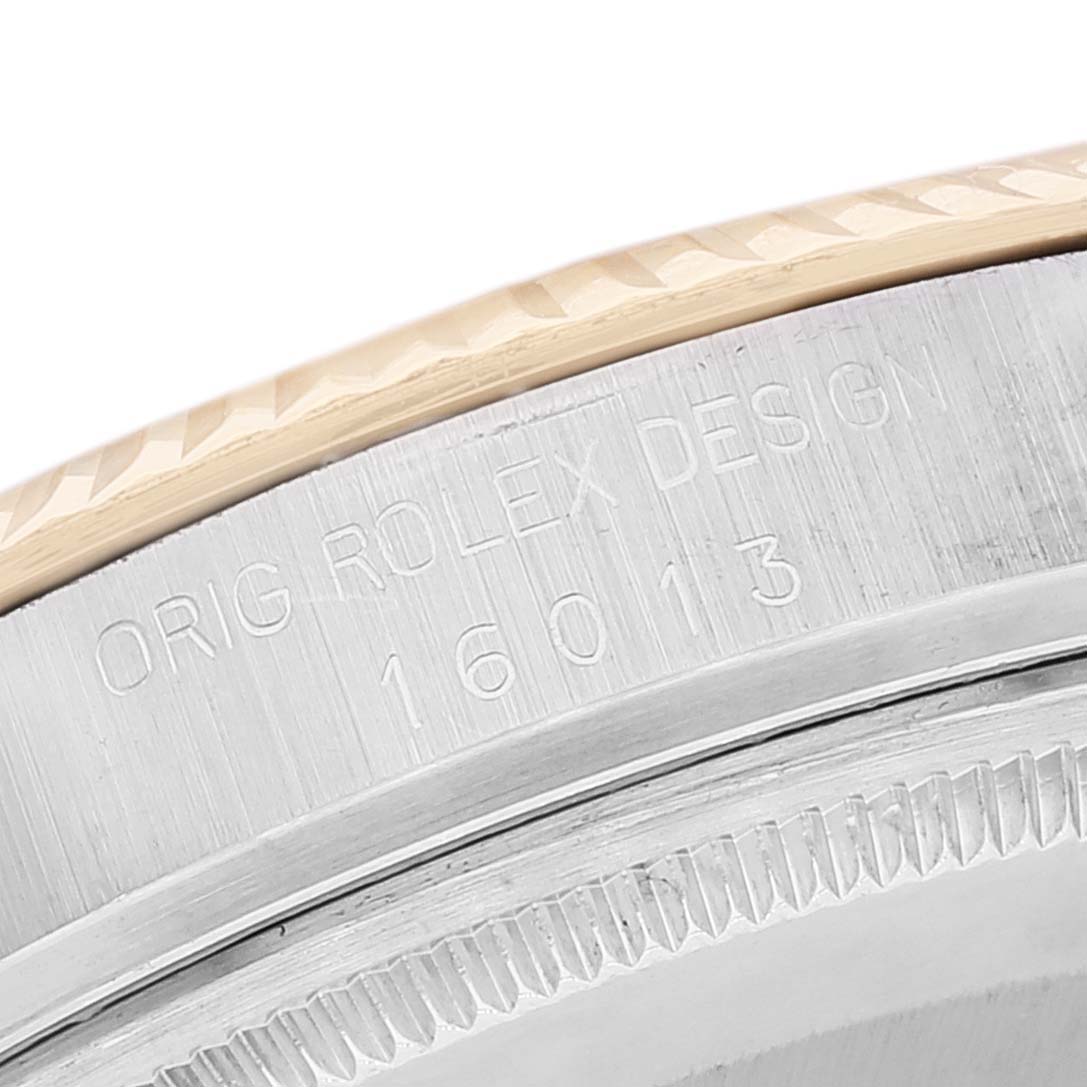 This image shows an engraving on the side of the bezel of a Rolex Vintage Collection 16013 Men's Steel and Gold (two tone) Silver Dial 16013 Men's Steel and Gold (two tone) Silver Dial model 16013 watch.
