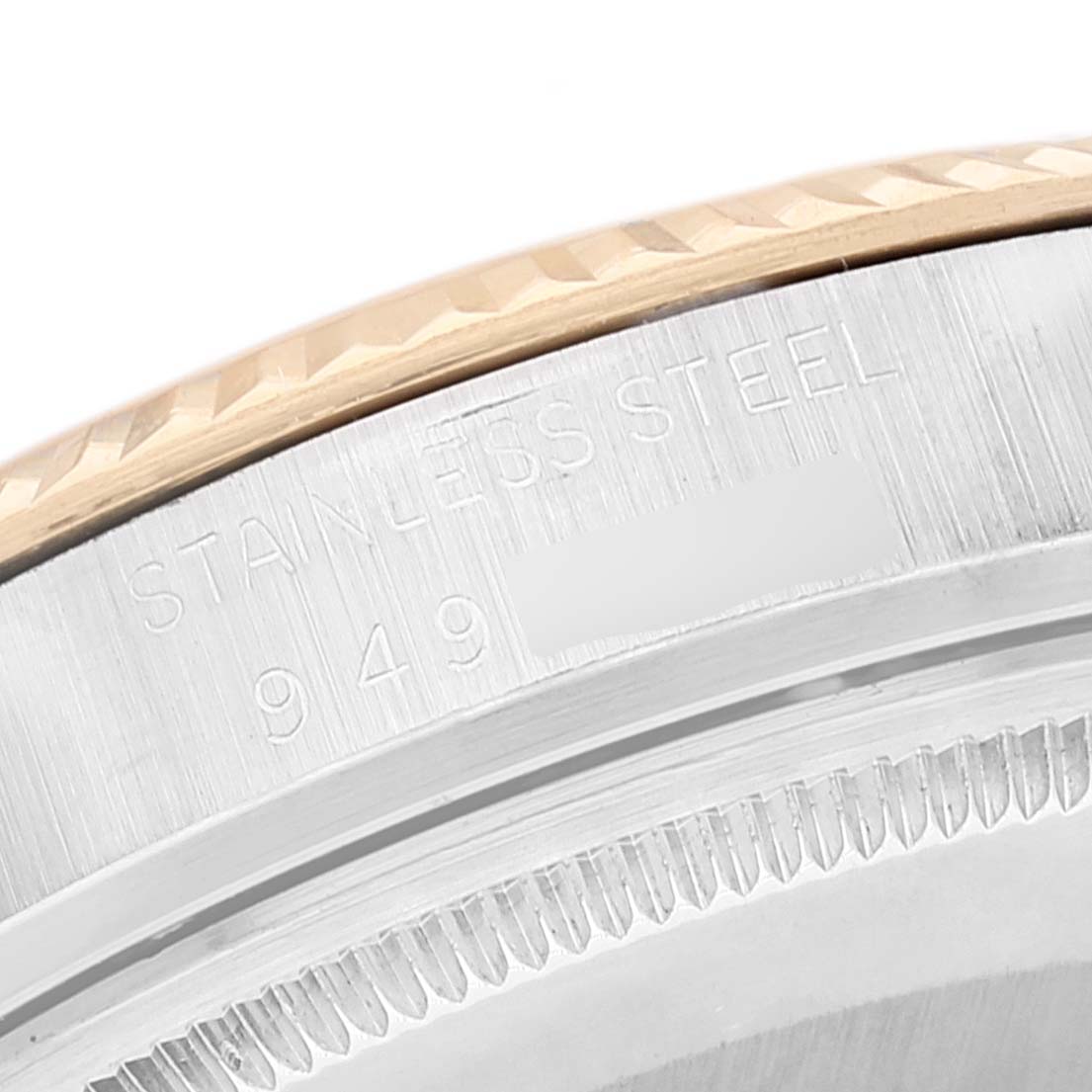 The image shows a close-up of the stainless steel case and engraved serial number of a Rolex Vintage Collection 16013 Men's Steel and Gold (two tone) Silver Dial 16013 Men's Steel and Gold (two tone) Silver Dial watch.