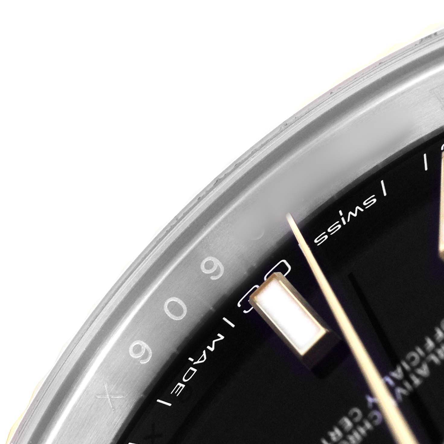 The close-up image shows part of the dial and bezel with indices of a Rolex Datejust 41 126333 Men's Steel and Gold (two tone) Black Dial watch.