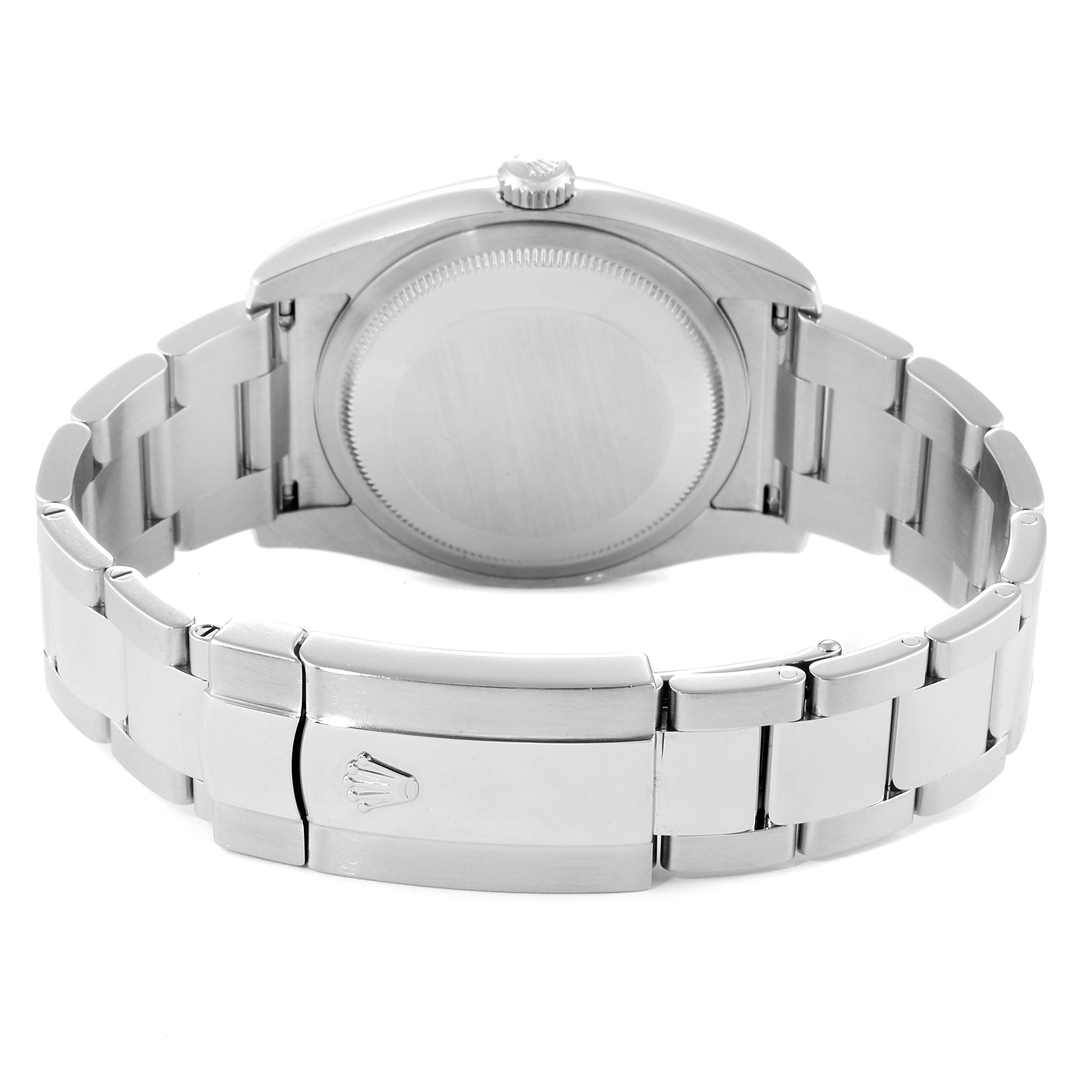 The image shows the back side of a Rolex Datejust 116200  Men's Stainless Steel Black Dial 116200  Men's Stainless Steel Black Dial watch, highlighting the case back and clasp of the bracelet.