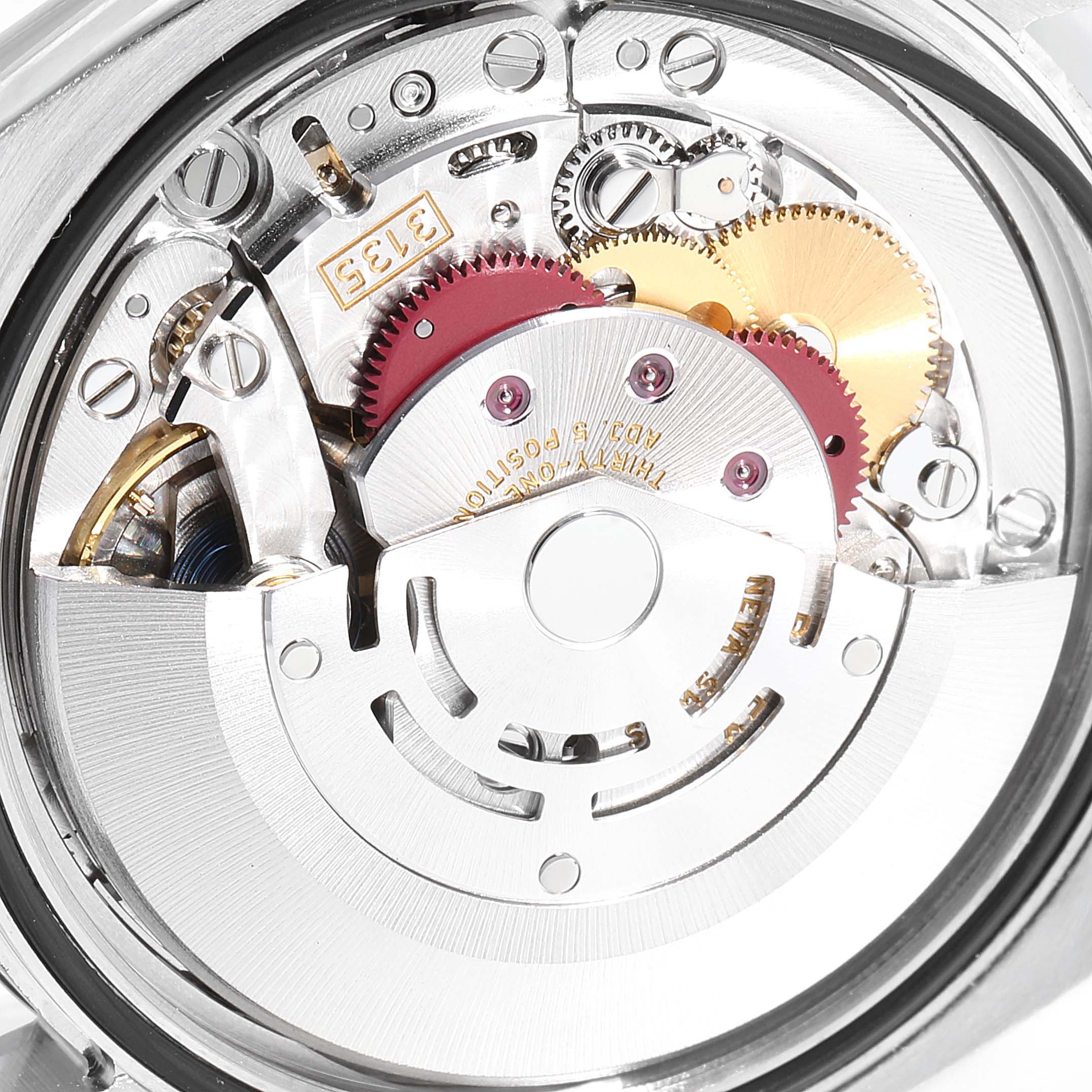 This image shows the internal mechanical movement of the Rolex Datejust 116200  Men's Stainless Steel Black Dial 116200  Men's Stainless Steel Black Dial watch, highlighting its gears and components.