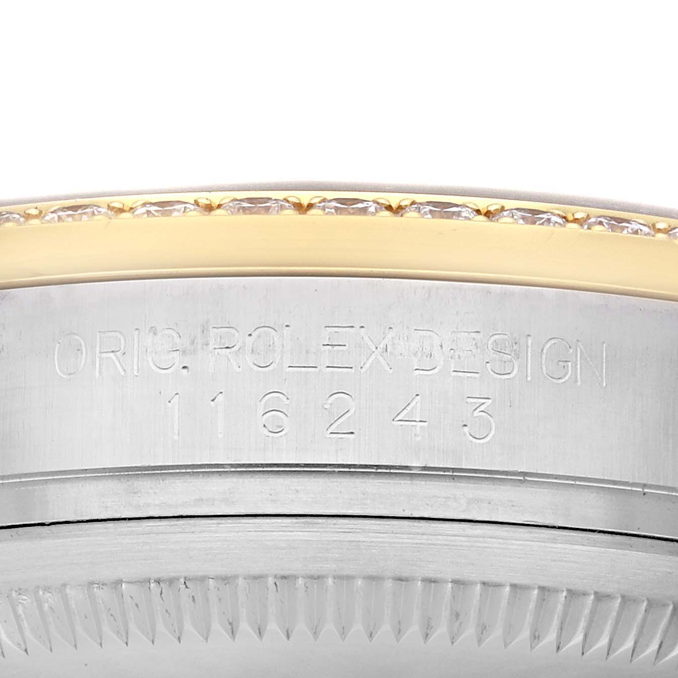 This image shows a close-up of the case side of a Rolex Datejust 116243 Men's Steel and Gold (two tone) Black Dial 116243 Men's Steel and Gold (two tone) Black Dial, focusing on the model number and part of the bezel.