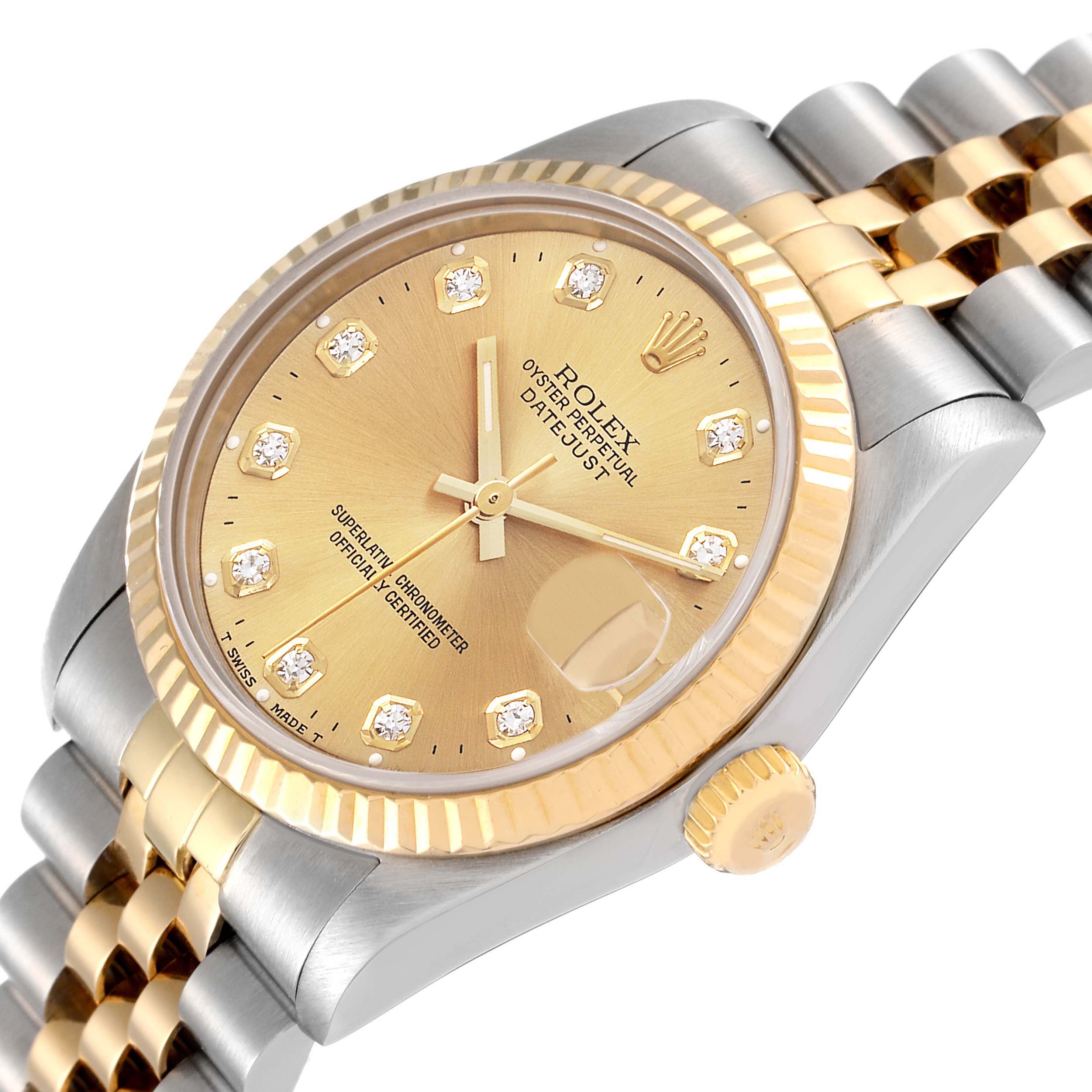 This Rolex Mid-Size 68273 Women
s Steel and Gold (two tone) Champagne Dial 68273 Women
s Steel and Gold (two tone) Champagne Dial Datejust watch is shown at an angled view, displaying the dial, bezel, crown, and jubilee bracelet.