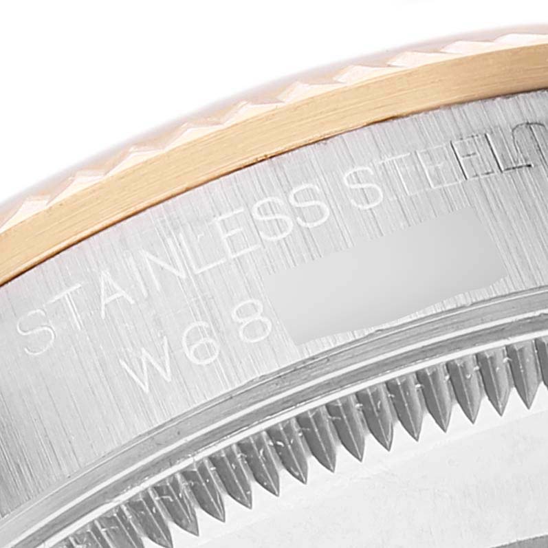 This close-up image shows the stainless steel back and fluted bezel of a Rolex Mid-Size 68273 Women
s Steel and Gold (two tone) Champagne Dial 68273 Women
s Steel and Gold (two tone) Champagne Dial model watch.