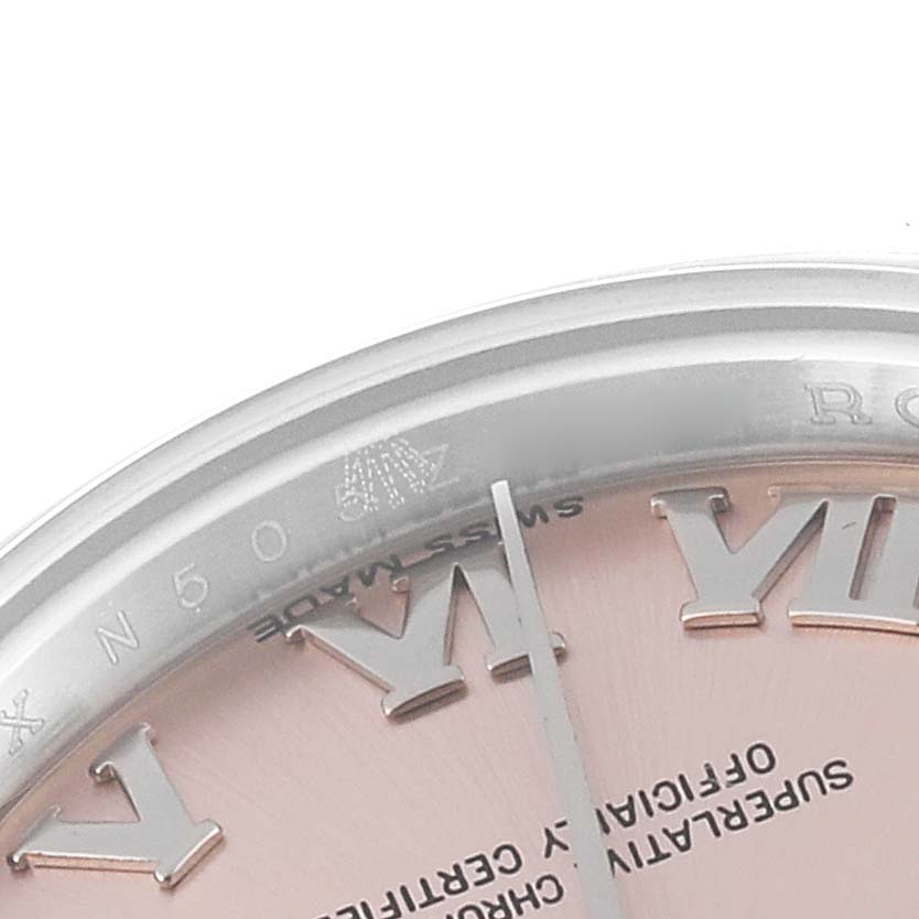 This image shows a close-up angle of the Rolex Datejust 179160 Women's Stainless Steel Pink Dial 179160 Women's Stainless Steel Pink Dial watch, highlighting part of its dial and Roman numerals.