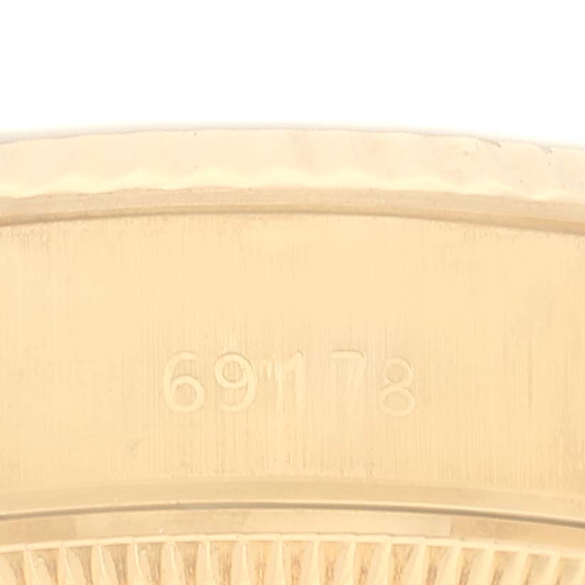 This image shows a close-up of the side of a Rolex President 69178 Women's Yellow Gold Champagne Dial 69178 Women's Yellow Gold Champagne Dial model watch case with the model number 69178 engraved.