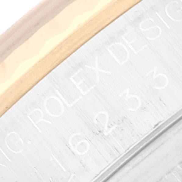 This close-up image shows the side engraving on the bezel of the Rolex Datejust 16233 Men's Steel and Gold (two tone) White Dial 16233 Men's Steel and Gold (two tone) White Dial watch.