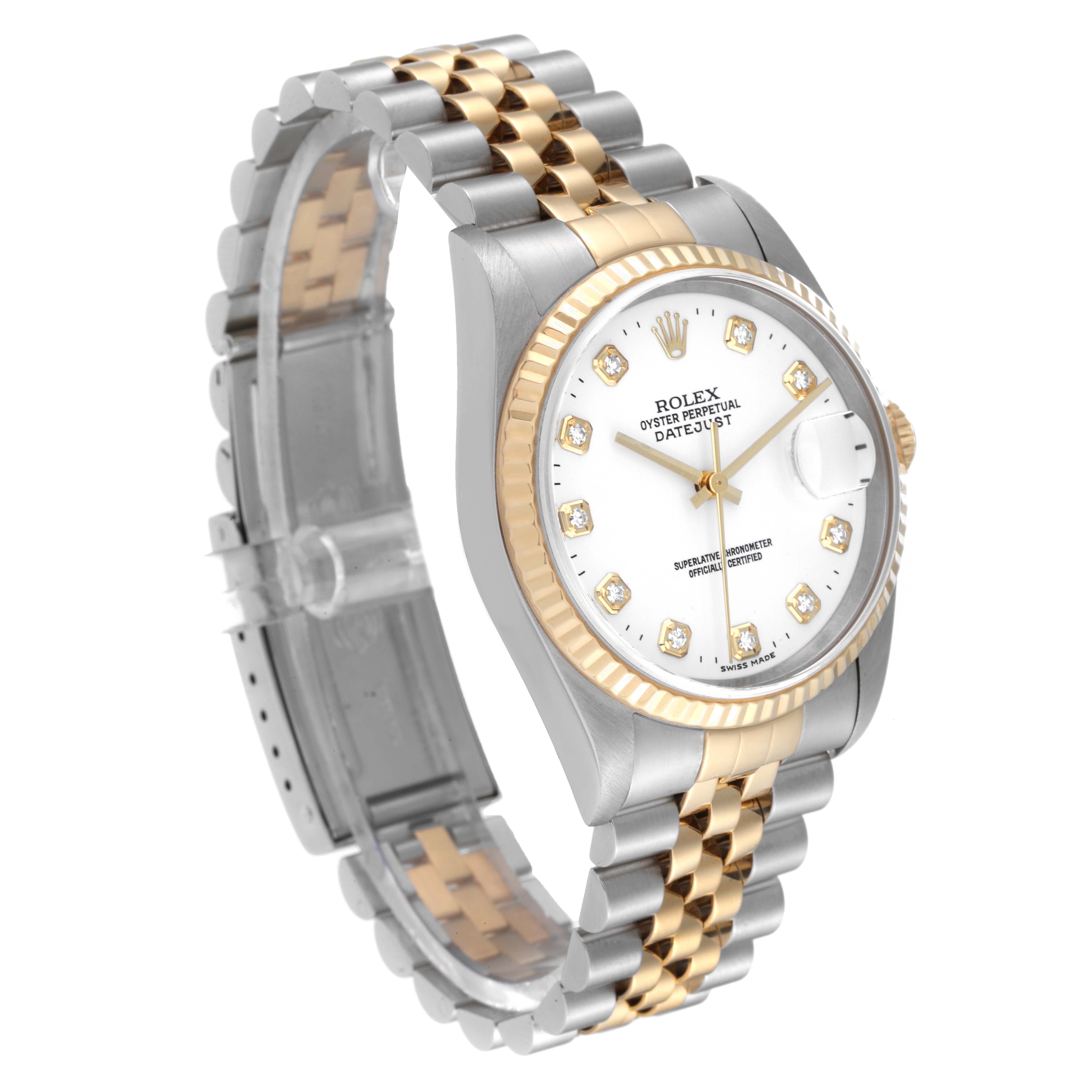This angled view of the Rolex Datejust 16233 Men's Steel and Gold (two tone) White Dial 16233 Men's Steel and Gold (two tone) White Dial watch shows the face, bezel, and two-tone bracelet.