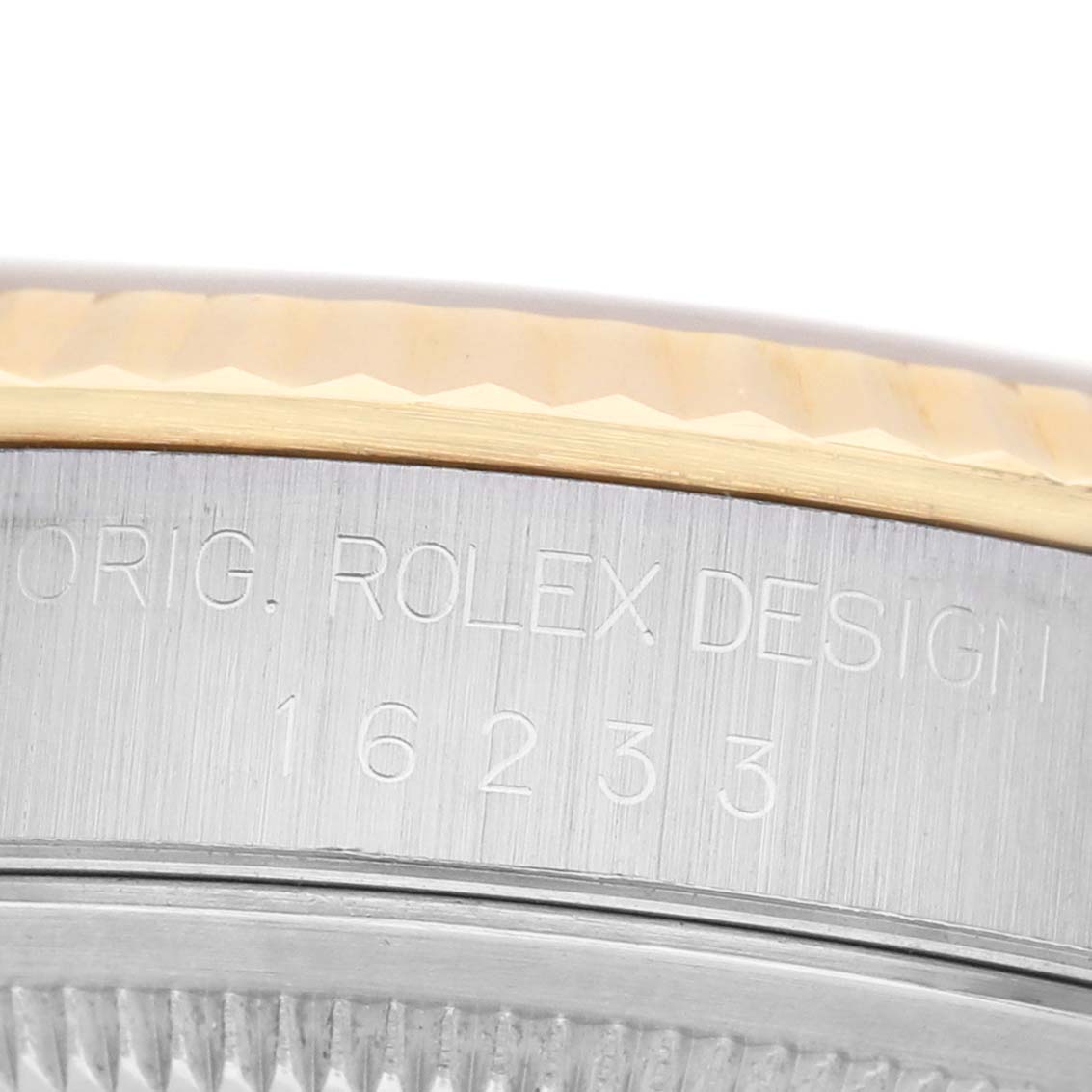 The image shows a close-up of the side case of a Rolex Datejust 16233 Men's Steel and Gold (two tone) Champagne Dial, displaying the model number engraving.
