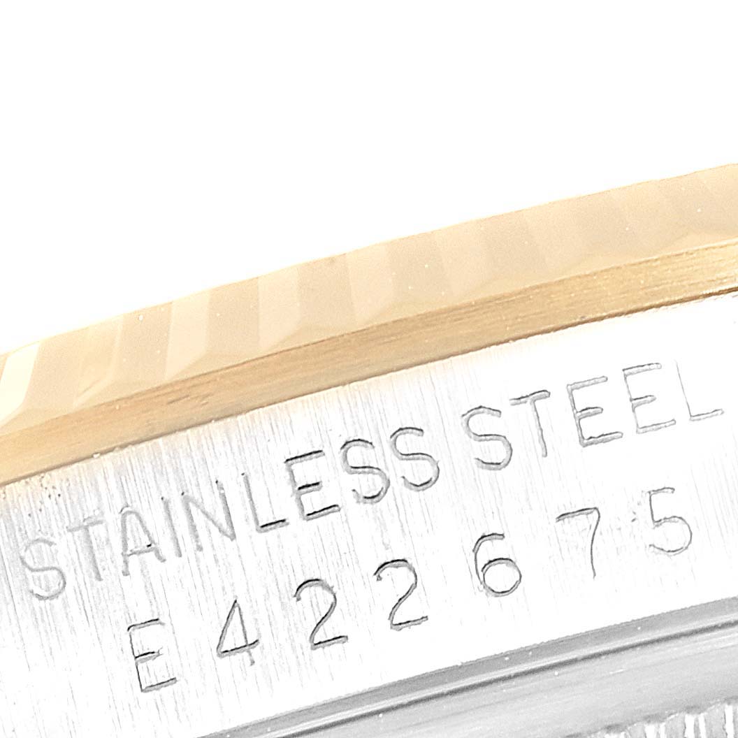 The image shows a close-up of the case side for the Rolex Datejust 16233 Men's Steel and Gold (two tone) Champagne Dial 16233 Men's Steel and Gold (two tone) Champagne Dial model, highlighting the stainless steel engraving and part of the bezel.