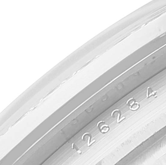 The image shows a close-up of the serial number engraving on the inner bezel of a Rolex Datejust 126284 Men's Stainless Steel Blue Dial 126284 Men's Stainless Steel Blue Dial watch.