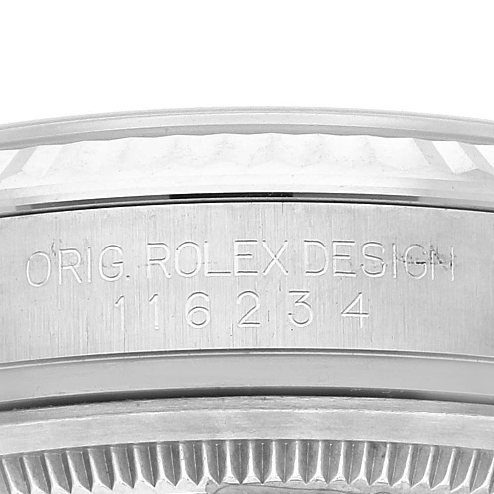 The image shows a close-up of the watch case side of a Rolex Datejust 116234 Men
s Stainless Steel Black Dial 116234 Men
s Stainless Steel Black Dial model, featuring engraved text and the bezel edge.