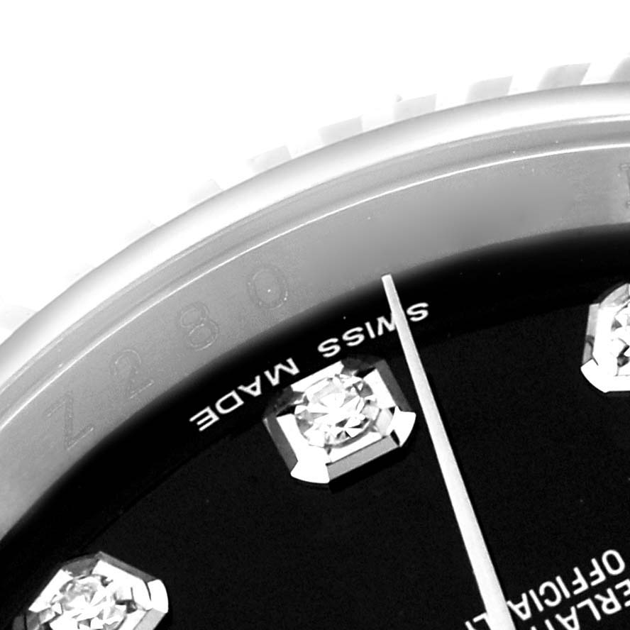 This close-up image shows a partial view of the dial and bezel engravings of a Rolex Datejust 116234 Men's Stainless Steel Black Dial 116234 Men's Stainless Steel Black Dial watch.