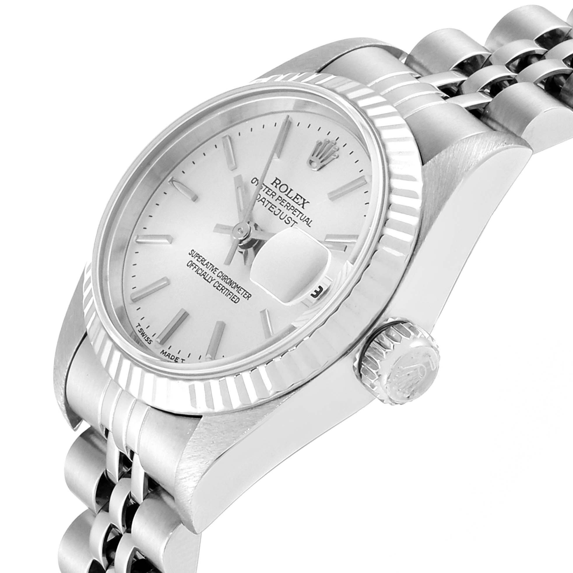 The image shows a close-up angle of a Rolex Datejust 69174 Women
s Stainless Steel Silver Dial 69174 Women
s Stainless Steel Silver Dial watch, highlighting its face, fluted bezel, crown, and part of the bracelet.