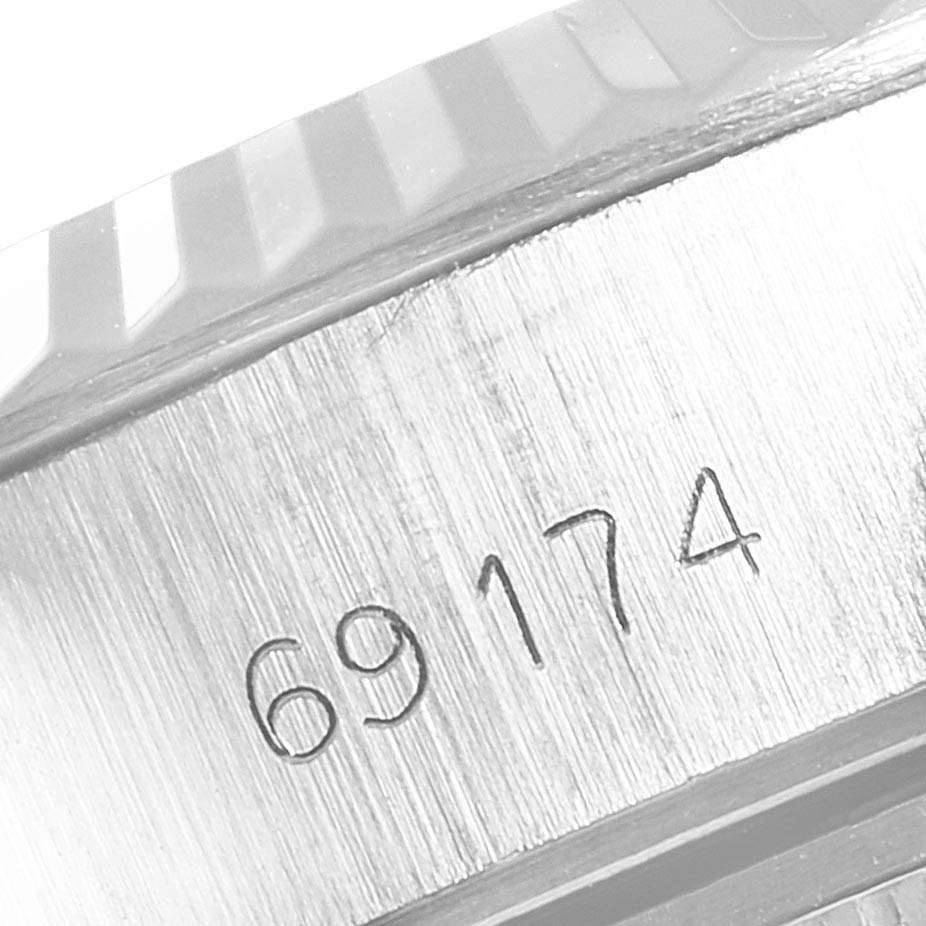 This is a close-up of the casing of a Rolex Datejust 69174 Women
s Stainless Steel Silver Dial 69174 Women
s Stainless Steel Silver Dial watch, showing the model number 69174.