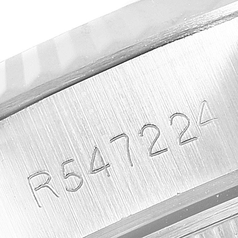 This image shows a close-up of the serial number engraving on the side of the Rolex Datejust 69174 Women
s Stainless Steel Silver Dial 69174 Women
s Stainless Steel Silver Dial watch case.