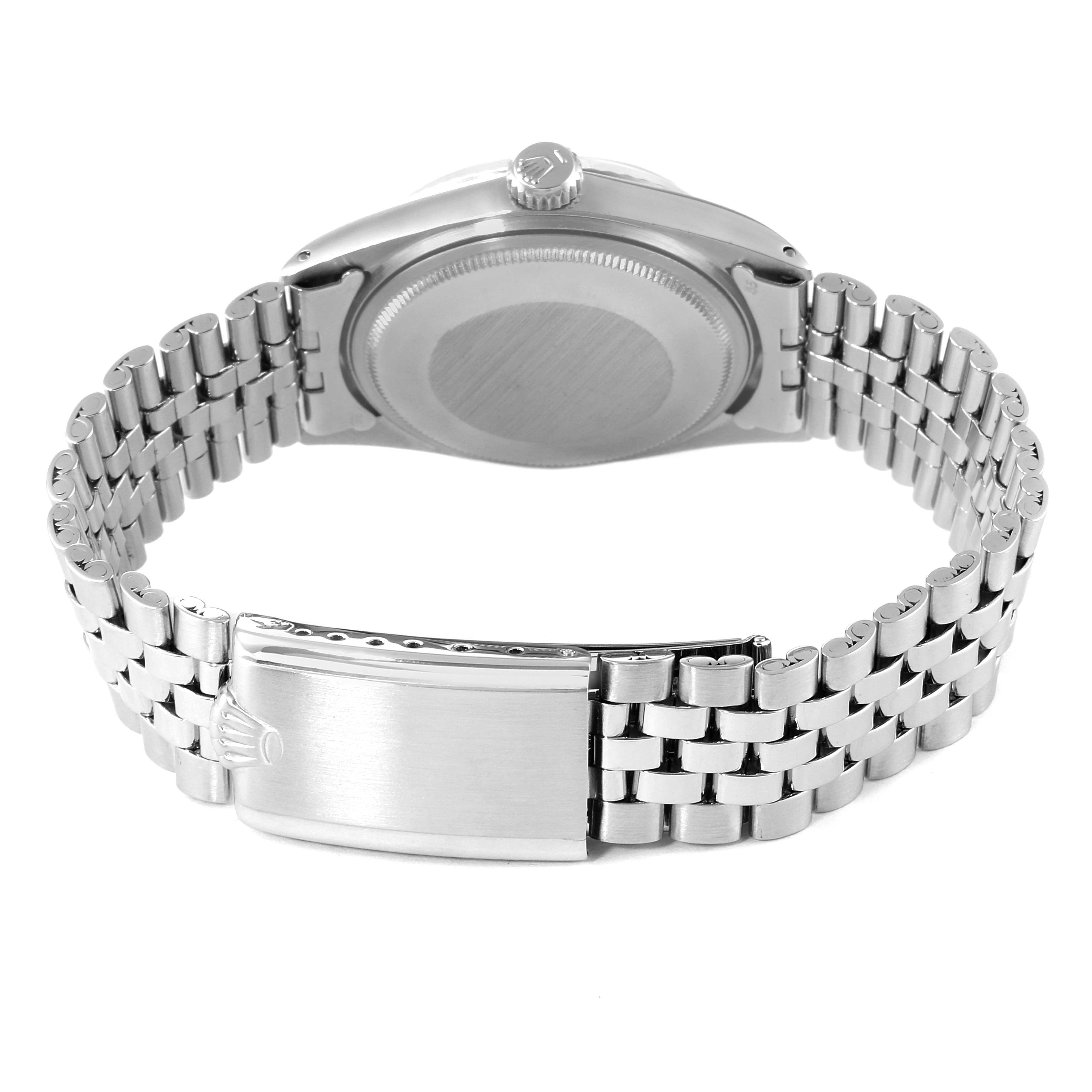 The image shows the back of the case and the bracelet of a Vintage Collection Rolex watch.