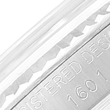 This is a close-up of the side of the Rolex Vintage Collection 1601 Men
s Stainless Steel Silver Dial 1601 Men
s Stainless Steel Silver Dial watch, showing the engraved model number and "Registered Design."