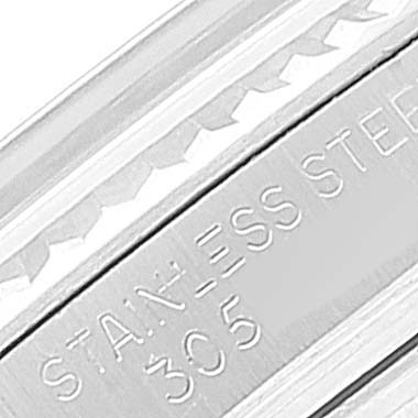 This close-up image shows the stainless steel casing of a Vintage Collection model by Rolex, specifically engraved with "STAINLESS STEEL 305".