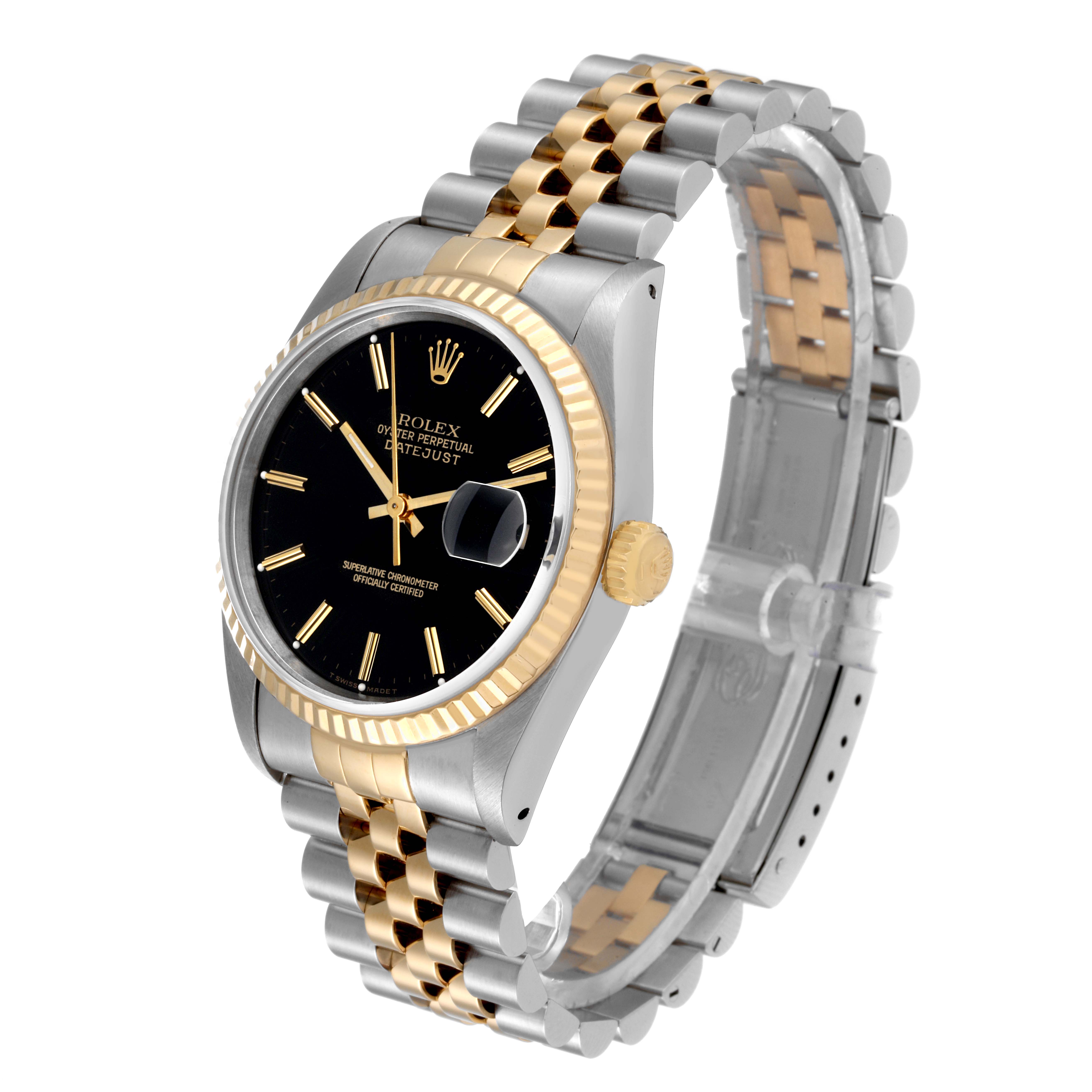 The Rolex Datejust 16233 Men's Steel and Gold (two tone) Black Dial 16233 Men's Steel and Gold (two tone) Black Dial watch is shown at an angled side view, highlighting its black dial, gold fluted bezel, and two-tone bracelet.
