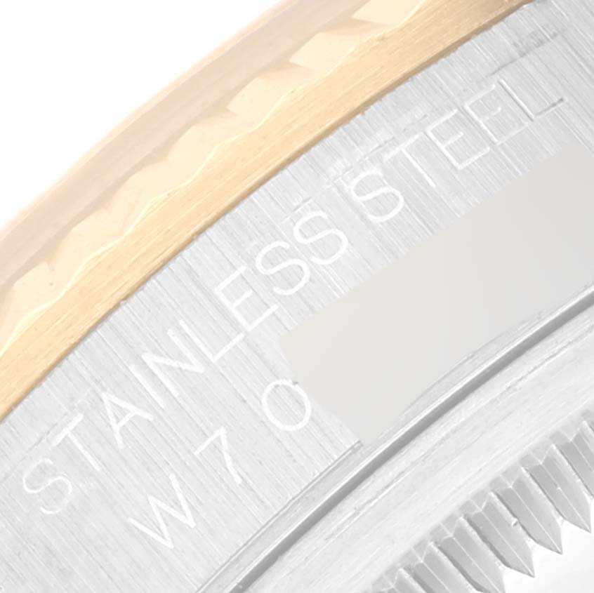 The image shows a close-up of the case edge of a Rolex Datejust 16233 Men's Steel and Gold (two tone) Champagne Dial 16233 Men's Steel and Gold (two tone) Champagne Dial, highlighting the stainless steel and gold portions.