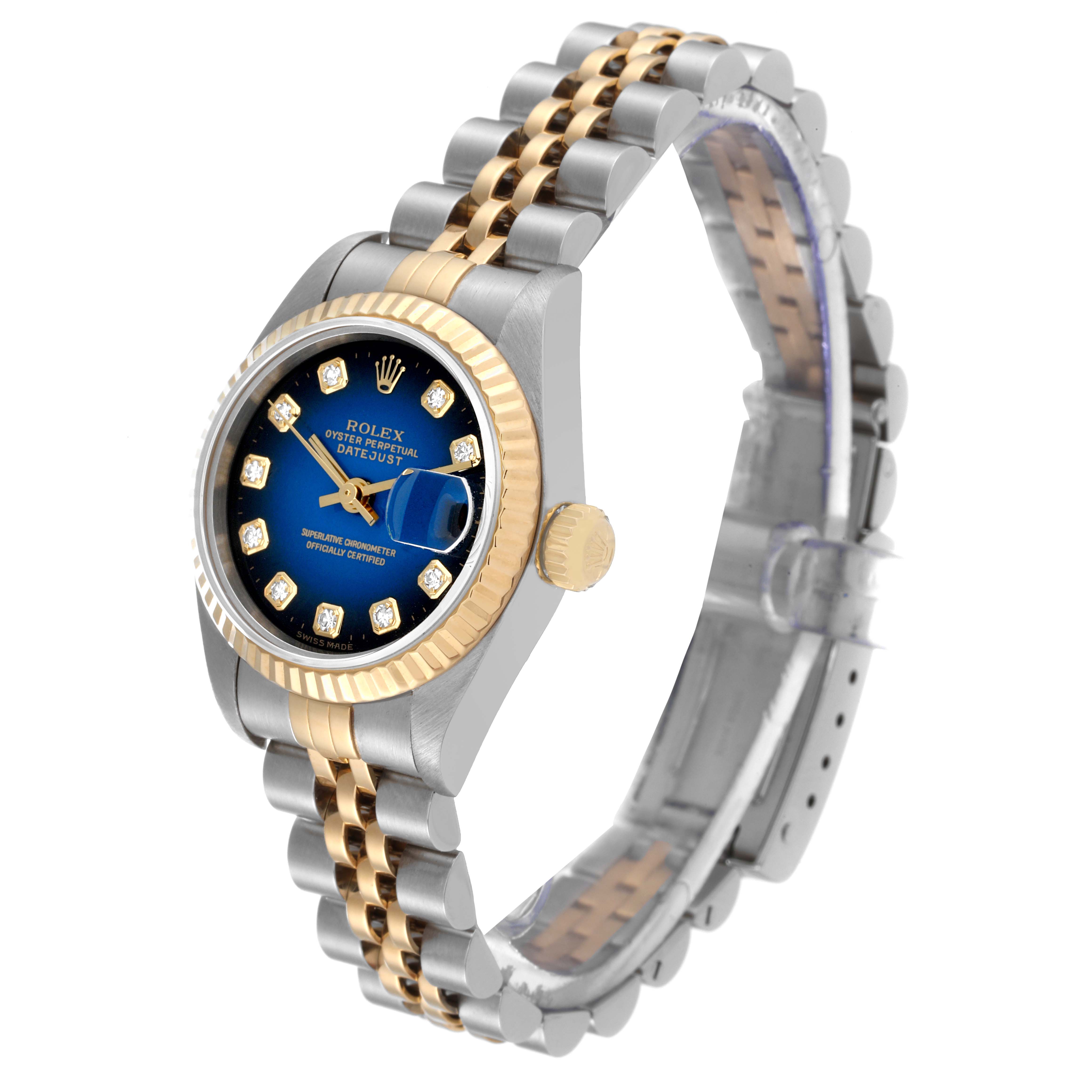 The image shows a Rolex Datejust 79173 Women's Steel and Gold (two tone) Blue Dial 79173 Women's Steel and Gold (two tone) Blue Dial watch at a three-quarter angle, highlighting its gold bezel, blue dial, and two-tone bracelet.