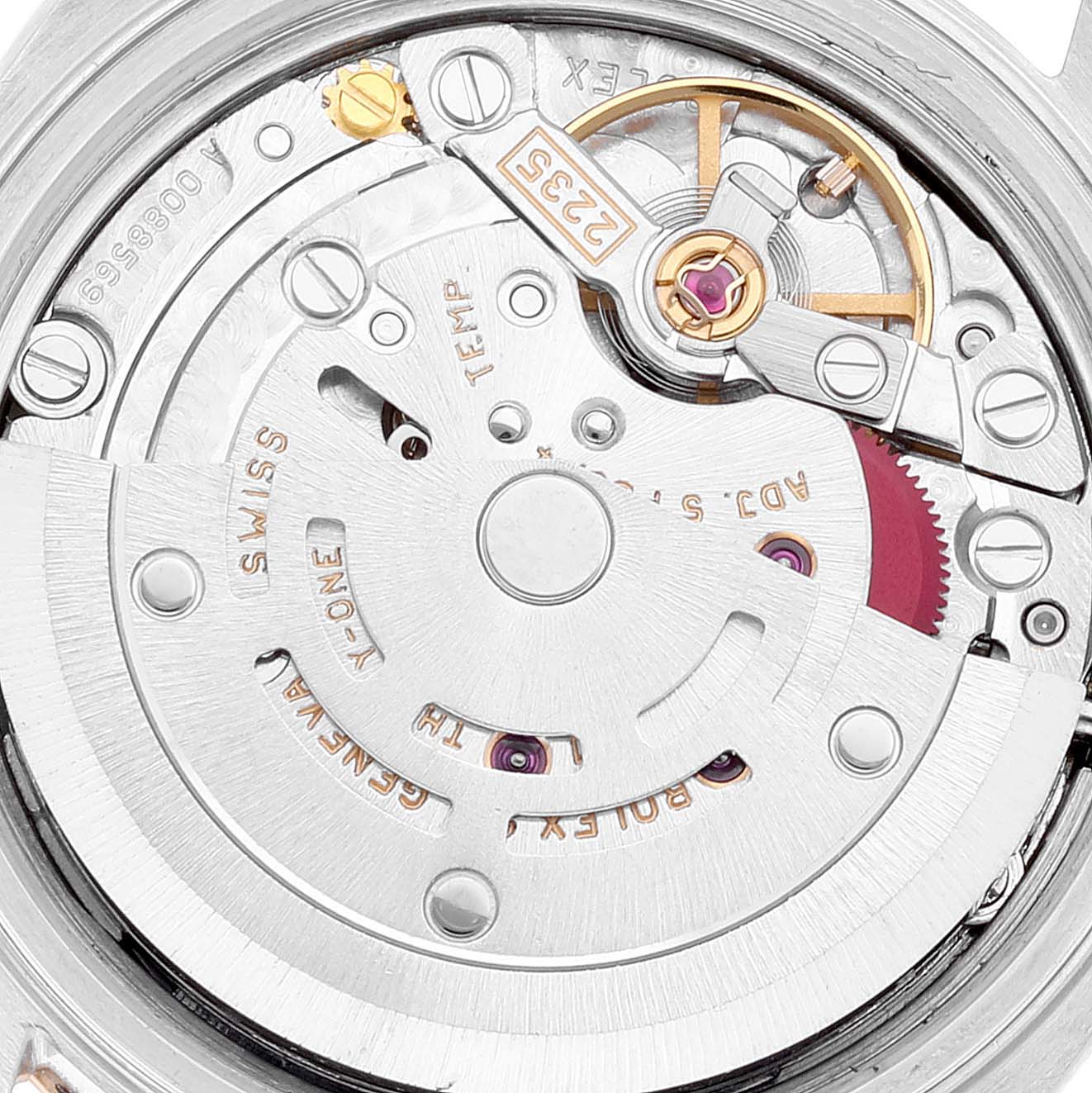 This close-up image depicts the intricate inner movement mechanism of a Rolex Datejust 79173 Women's Steel and Gold (two tone) Blue Dial 79173 Women's Steel and Gold (two tone) Blue Dial watch, featuring gears and screws.