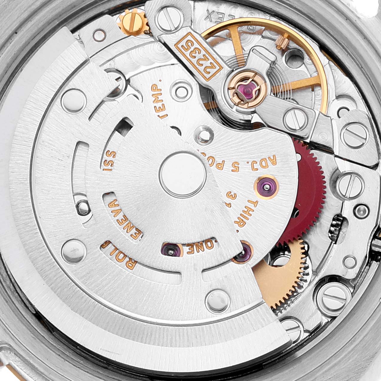 This is a close-up view of the movement inside a Rolex Datejust 179173 Women's Steel and Gold (two tone) Mother of Pearl Dial 179173 Women's Steel and Gold (two tone) Mother of Pearl Dial watch, showing its intricate mechanical components.