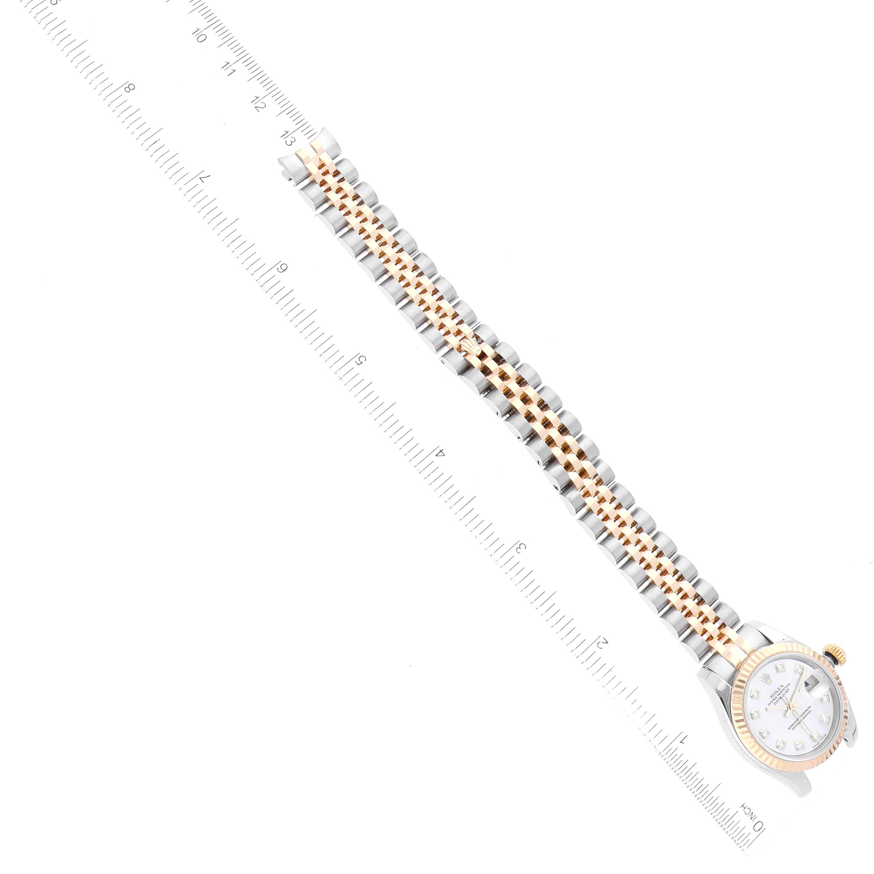 The image shows a top view of a Rolex Datejust 179173 Women's Steel and Gold (two tone) Mother of Pearl Dial 179173 Women's Steel and Gold (two tone) Mother of Pearl Dial watch, displaying its two-tone bracelet and partially visible face.