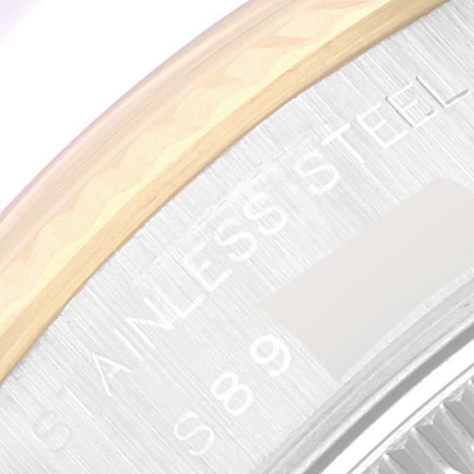 This image shows a close-up of the stainless steel case and bezel of a Rolex Datejust 69173 Women's Steel and Gold (two tone) White Dial 69173 Women's Steel and Gold (two tone) White Dial watch.