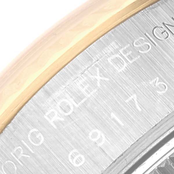 This close-up image shows the engraved inner bezel of a Rolex Datejust 69173 Women's Steel and Gold (two tone) White Dial 69173 Women's Steel and Gold (two tone) White Dial watch with "ROLEX DESIGN" visible.