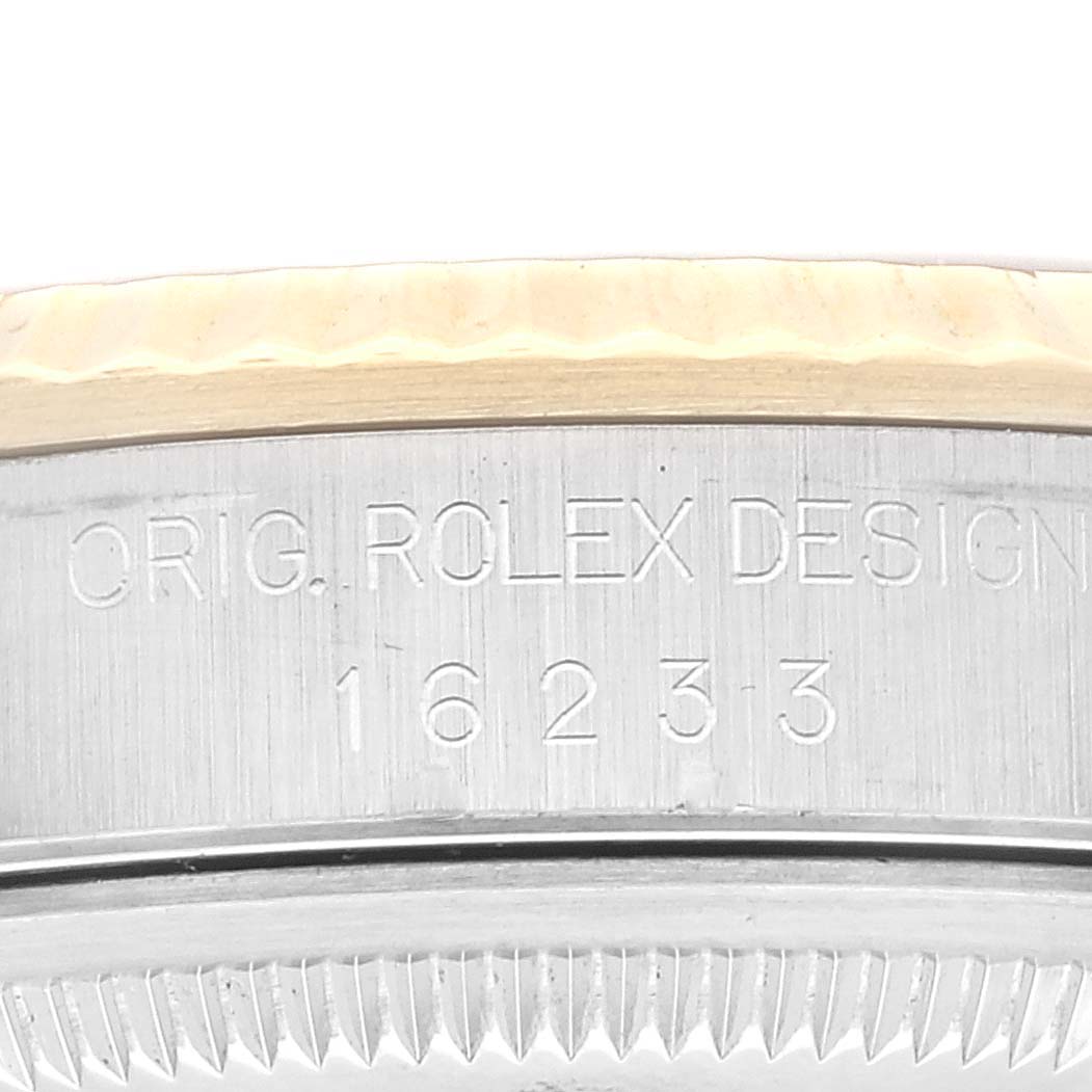 This image shows the model number and design engraving on the side of a Rolex Datejust 16233 Men's Steel and Gold (two tone) Grey Dial 16233 Men's Steel and Gold (two tone) Grey Dial watch.