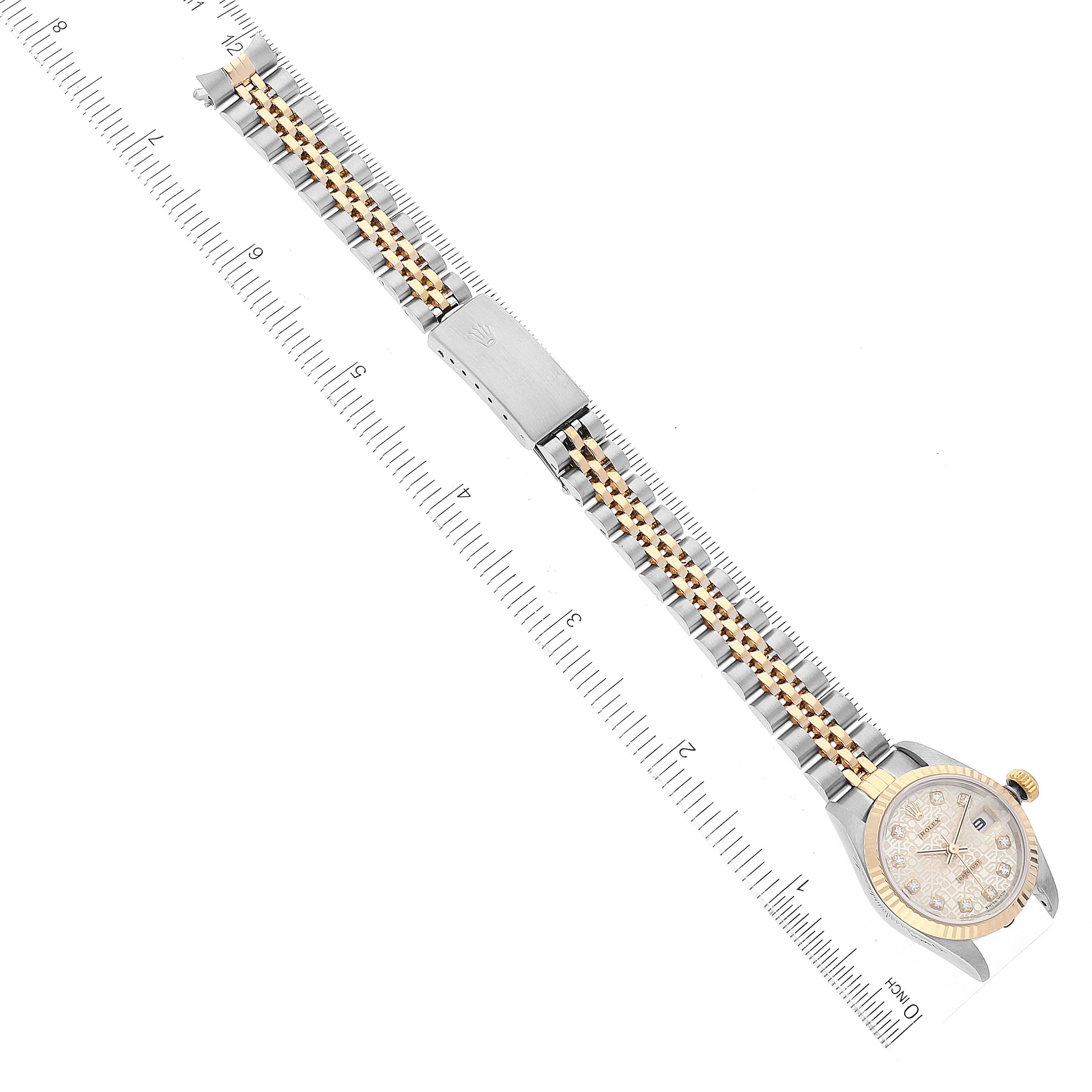 The image shows a top-down view of a Rolex Datejust 79173 Women's Steel and Gold (two tone) Silver Dial 79173 Women's Steel and Gold (two tone) Silver Dial watch, including the full bracelet and clasp.